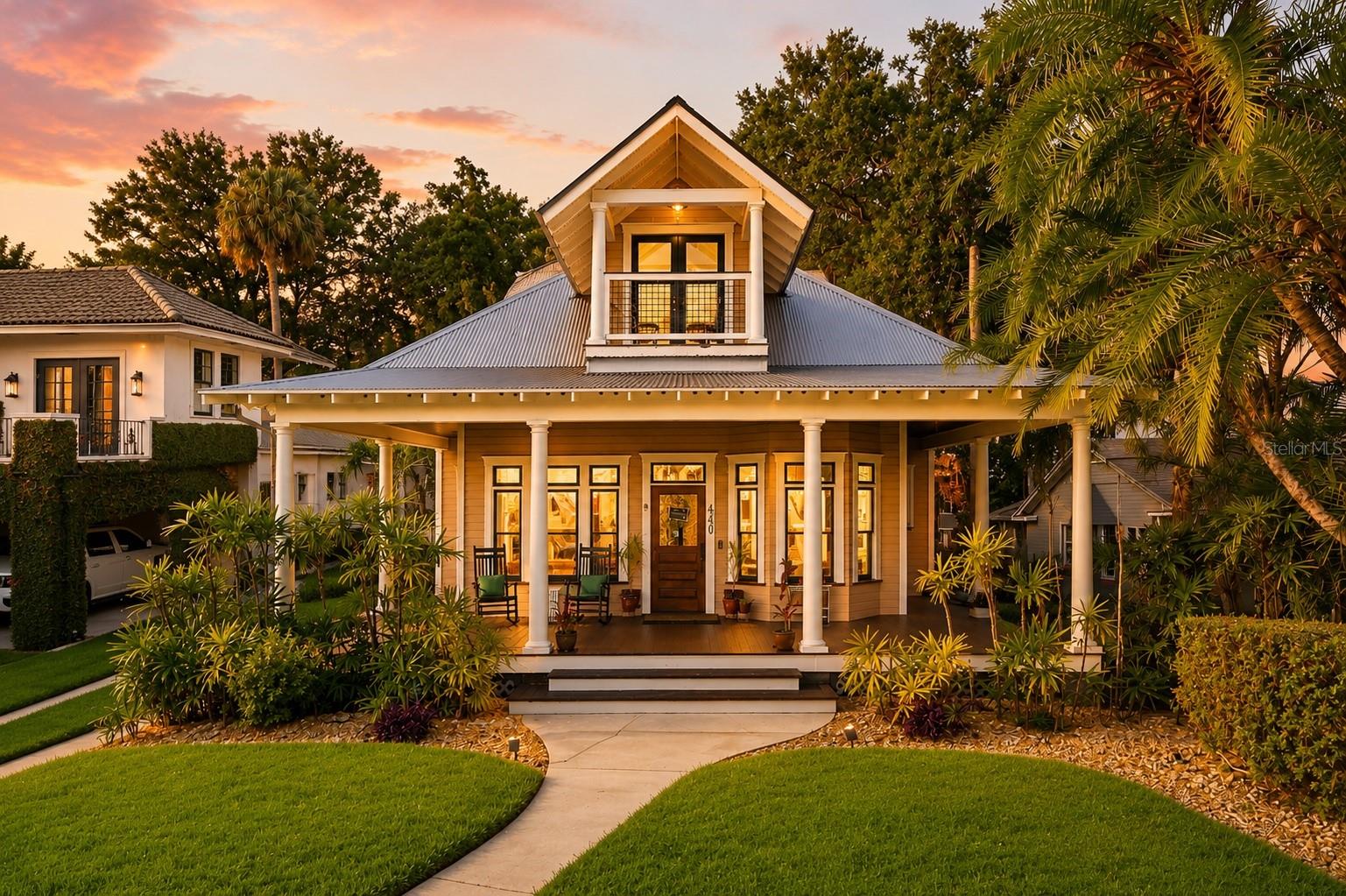 Welcome to one of downtown Orlando's most distinctive homes, perfectly positioned across from Lake Cherokee in the heart of the Historic Lake Cherokee District. With sweeping lake views and the downtown skyline as your backdrop, this property offers a lifestyle that is truly difficult to replicate.

Designed with a blend of timeless Key West charm and open, airy living spaces, the home is filled with architectural character and natural light. Transom windows, French doors, soaring ceilings, and 125-year-old reclaimed heart pine floors create a warm and inviting atmosphere throughout.

The kitchen has been thoughtfully updated with newer quartz countertops and features custom wood cabinetry, stainless steel appliances, and a gas range. Additional recent improvements include a newer refrigerator, dishwasher, water heater, lighting fixtures, and fresh interior paint throughout much of the home. The primary bathroom has also been updated with beautiful quartz countertops.

One of the home's most appealing features is its flexible floor plan. The spacious primary suite occupies the entire second floor and opens to a private balcony overlooking Lake Cherokee and the downtown skyline. A second en-suite bedroom on the first floor features french doors leading directly to the covered porch, making it ideal for guests or multigenerational living. Need additional space? The large downstairs office could easily function as a fourth bedroom.

Outdoor living takes center stage with nearly 1,400 square feet of wraparound porch space designed for relaxing, entertaining, and enjoying the picturesque lake views. Whether you're sipping coffee while watching the swans glide across the water or gathering with friends on a cool evening, this home was designed to embrace its surroundings. A custom pergola over the parking area creates a spacious covered carport while enhancing the beautiful backyard.

Located just blocks from Lake Eola, Thornton Park, the Dr. Phillips Center for the Performing Arts, Orlando Health, and Delaney Park, you'll enjoy the convenience of downtown living while being surrounded by one of Orlando's most charming historic neighborhoods. Zoned for highly regarded Blankner K-8 and Boone High School.

If you've been searching for a home with character, flexibility, and unforgettable views, this Lake Cherokee gem is one you won't want to miss.
