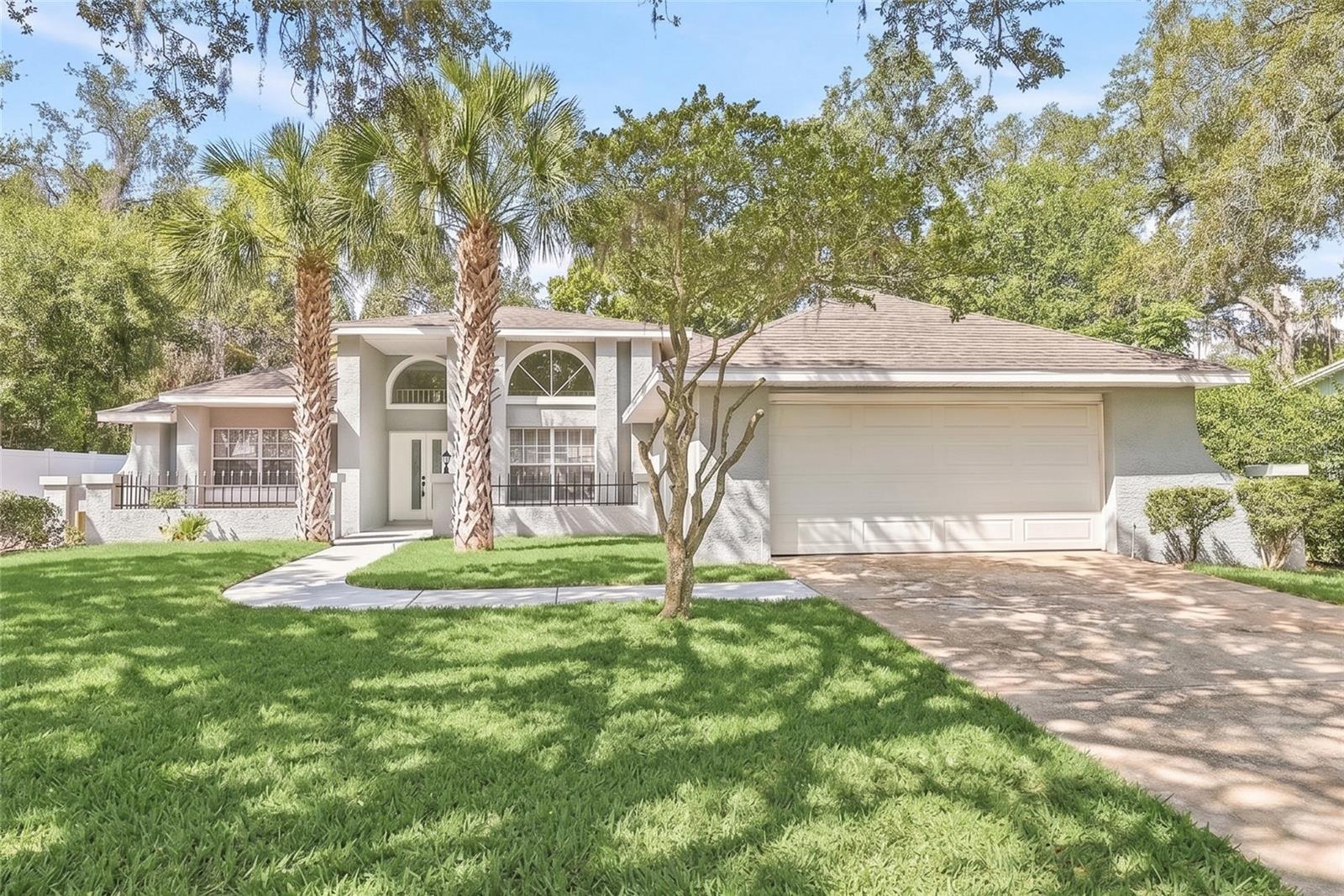 Welcome to this beautifully renovated 3-bedroom, 2-bathroom POOL home where modern design meets everyday functionality. From the moment you step inside, you'll appreciate the bright, open floor plan, soaring vaulted ceilings, and stylish updates that make this home feel both inviting and impressive. The heart of the home is the stunning brand-new kitchen, thoughtfully designed with a clean, modern aesthetic, all-new appliances, and a large center island that creates the perfect gathering space for family, friends, and entertaining. The open layout flows seamlessly into the main living area, while the loft overlooking the living space adds architectural character and flexibility for a home office, reading nook, game room, or additional living space.

The spacious primary suite serves as a true retreat, featuring a custom walk-in closet and a beautifully remodeled en suite bathroom complete with a freestanding soaking tub, separate shower, and designer-inspired finishes. The split-bedroom floor plan offers privacy, while the generously sized secondary bedrooms and fully remodeled guest bathroom with a double vanity provide comfortable accommodations for family and guests. Storage is abundant throughout the home, with hallway linen closets and a dedicated indoor laundry room featuring cabinetry and a utility sink.

Step outside and discover your own backyard oasis. The fully enclosed Florida room with ceiling fans creates the perfect transition between indoor and outdoor living, overlooking the screened pool and spacious backyard. A vinyl privacy fence surrounds the property, creating a private setting for relaxing, entertaining, or enjoying Florida's beautiful weather year-round. With luxury vinyl plank flooring throughout, a 2-car garage, thoughtful updates at every turn, and a layout designed for both entertaining and everyday living, this move-in-ready home offers the perfect blend of modern style, comfort, and functionality.

Ideally located in Tarpon Springs, you'll enjoy convenient access to shopping, dining, parks, golf courses, top-rated beaches, and the area's famous waterfront attractions, all while being tucked away in an established neighborhood that offers both convenience and charm.