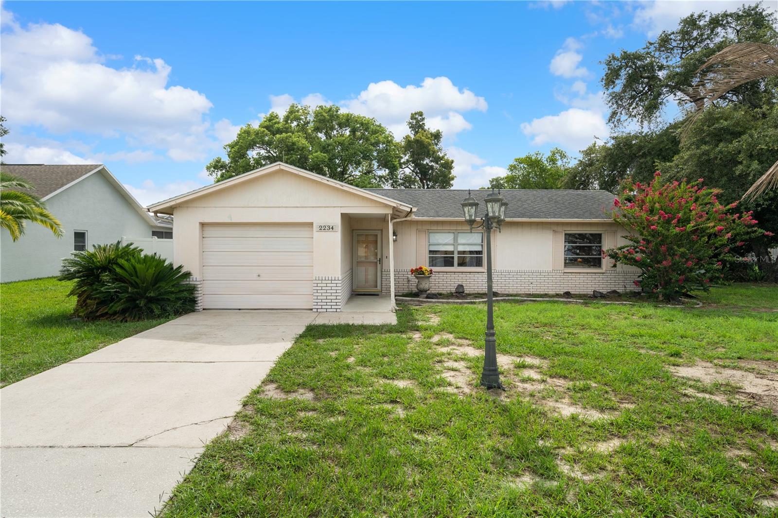 Conveniently located Pool home in Spring Hill! Lovely 2 bedroom 2 bathroom retreat. Enclosed garage under heat & air providing extra living space, used as a den/bedroom (not included in living sq ft) Split bedroom plan with an open kitchen to living and dining areas. New Diamond Brite pool finish & enclosure rescreening. Privacy fenced back yard with a 10x20 powered up utility shed. Extra10x12 attached storage shed. Within half a mile to a grocery store, pharmacy, gas station, fast food, take out, restaurants, salons, etc
