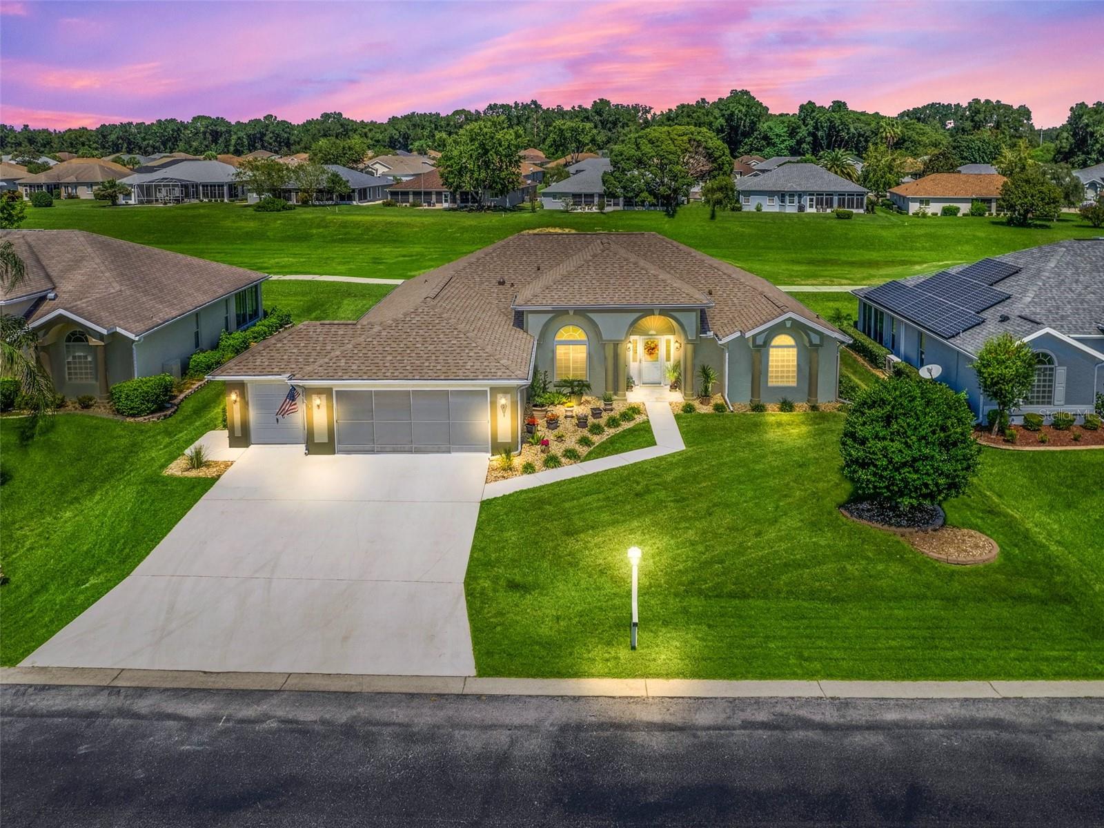 Experience the best of golf course living in this beautifully upgraded 2,264 living square foot home, ideally situated in the highly sought-after 55+ community of Ocala Palms. Overlooking the 10th tee box with no rear neighbors, this exceptional property offers breathtaking views, privacy, and the relaxed Florida lifestyle you've been searching for. Inside, you'll find a spacious, thoughtfully designed floor plan enhanced with elegant crown molding throughout, luxury vinyl plank flooring, and an abundance of natural light. Every detail has been carefully maintained, creating a home that is both stylish and move-in ready. The true showstopper is the expansive 45-foot tiled lanai, offering the perfect setting to enjoy morning coffee, entertain guests, or unwind while overlooking the beautifully manicured golf course. Whether you're watching golfers tee off or taking in the peaceful surroundings, this outdoor living space is sure to become your favorite retreat.
The oversized garage includes a dedicated golf cart bay, making it easy to enjoy all that Ocala Palms has to offer. Furniture is negotiable, providing the opportunity for a truly turnkey purchase. Ocala Palms is one of Ocala's premier gated 55+ communities, featuring an 18-hole championship golf course, clubhouse, resort-style pool and spa, fitness center, tennis and pickleball courts, bocce ball, library, arts and crafts, countless social clubs, and a full calendar of activities. Conveniently located just minutes from the World Equestrian Center, shopping, dining, medical facilities, and major highways, you'll enjoy the perfect combination of peaceful living and everyday convenience. This is more than just a home—it's the lifestyle you've been waiting for. (Roof 2018 / HVAC 2023)
