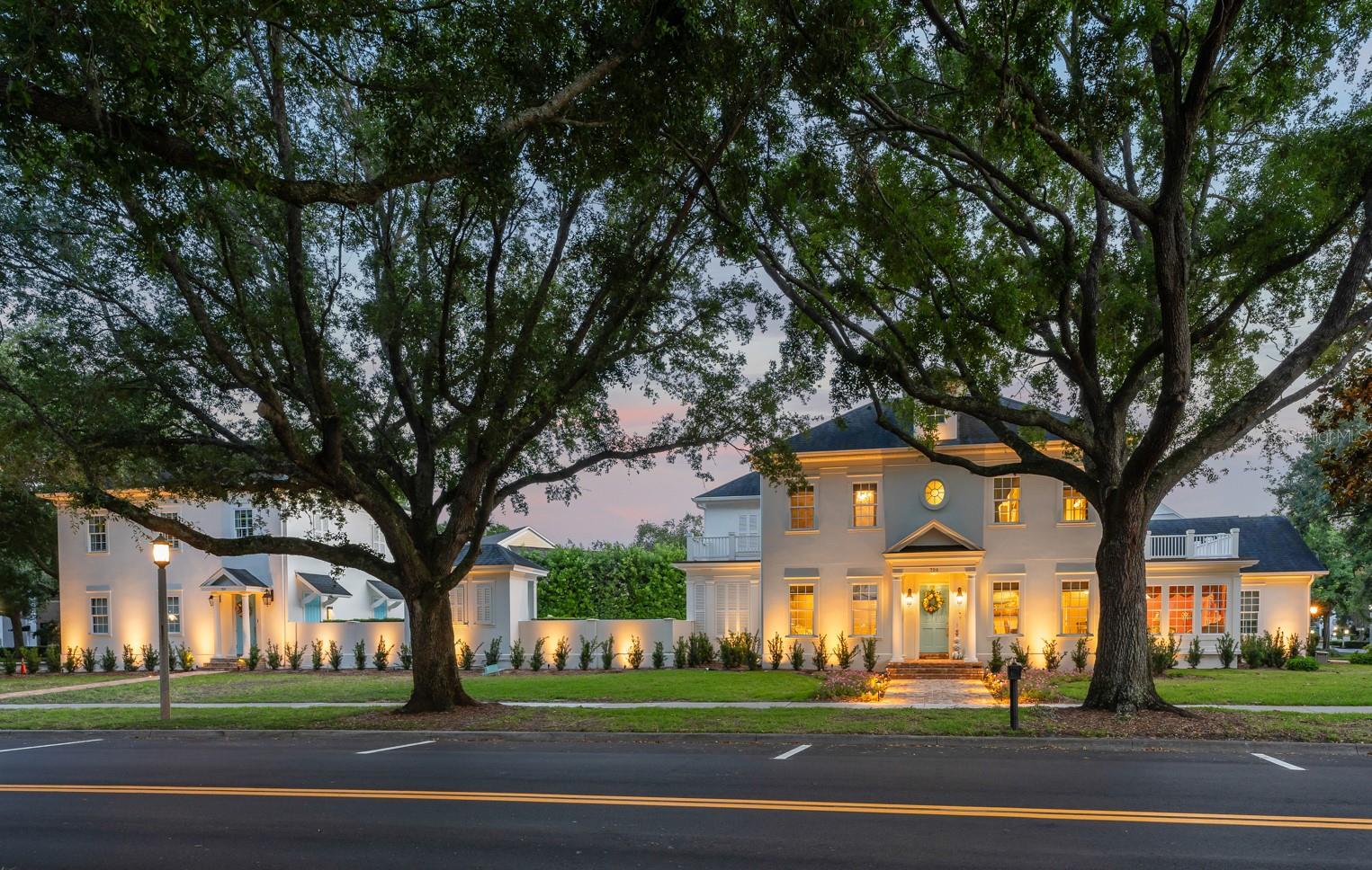 Welcome to Crescentwood, a truly rare offering in the Main Village of Celebration, a fully reimagined estate set across two homesites, creating a scale and presence seldom found within the community. Thoughtfully renovated with high-end materials and custom finishes throughout, the residence blends timeless architecture with modern luxury in a way that is both refined and highly livable.

As you enter, the foyer welcomes you with substantial millwork, curated lighting, and a level of craftsmanship that immediately defines the residence. Formal and casual living spaces are elegantly proportioned, featuring beautiful tile flooring, layered ceiling details with integrated lighting, custom built-ins, French doors and oversized windows that fill the interiors with natural light. A beautiful sitting room framed by eight windows creates an inviting space bathed in natural light throughout the day.

At the center of the home, the completely redesigned chef’s kitchen showcases custom Poggenpohl cabinetry, premium integrated appliances, dramatic illuminated stone surfaces, extensive preparation space, and a seamless connection to the adjacent living and dining areas, creating an ideal setting for both entertaining and everyday living.

The owner’s suite serves as a luxurious private retreat with a spa-inspired bath finished in striking marble, custom fixtures, and refined architectural detailing. The suite is further enhanced by two walk-in closets, offering exceptional organization and boutique-style functionality. Each secondary bedroom are designed as private ensuite retreats complete with walk-in closets and beautifully updated bathrooms featuring elevated finishes and distinctive design details. The third-story movie room offers a true cinematic experience tucked away as a private entertainment space.

Adding to the property’s versatility is a fully upgraded one-bedroom apartment featuring a private entrance, luxurious bath with a freestanding tub and separate shower, eat in space, living room and full-size washer and dryer offering ideal flexibility for guests, extended family or private office space.

The main residence includes a two-car garage, while automotive enthusiasts and collectors will especially appreciate the separate temperature controlled oversized three-car garage. Designed with high ceiling height to accommodate vehicle lifts, the space has the potential to house up to six vehicles—an extraordinarily rare amenity within Celebration.

The outdoor living experience is equally impressive, featuring a swimming pool and spa surrounded by elegant limestone pavers, summer kitchen, covered entertaining areas, and lush landscaping. A substantial stucco masonry wall encloses the grounds, creating an ultra-private backyard and pool setting rarely found within Celebration’s Main Village. Extensive landscape lighting beautifully illuminates the property and architectural details in the evening, enhancing the estate’s ambiance and presence after sunset. Multiple outdoor gathering spaces further elevate the estate-like atmosphere, creating the feel of a private luxury resort.

Crescentwood represents a one-of-one opportunity within Celebration, offering the rarity of a double homesite, a fully renovated luxury residence and a level of finish and scale that is nearly impossible to replicate within the Main Village