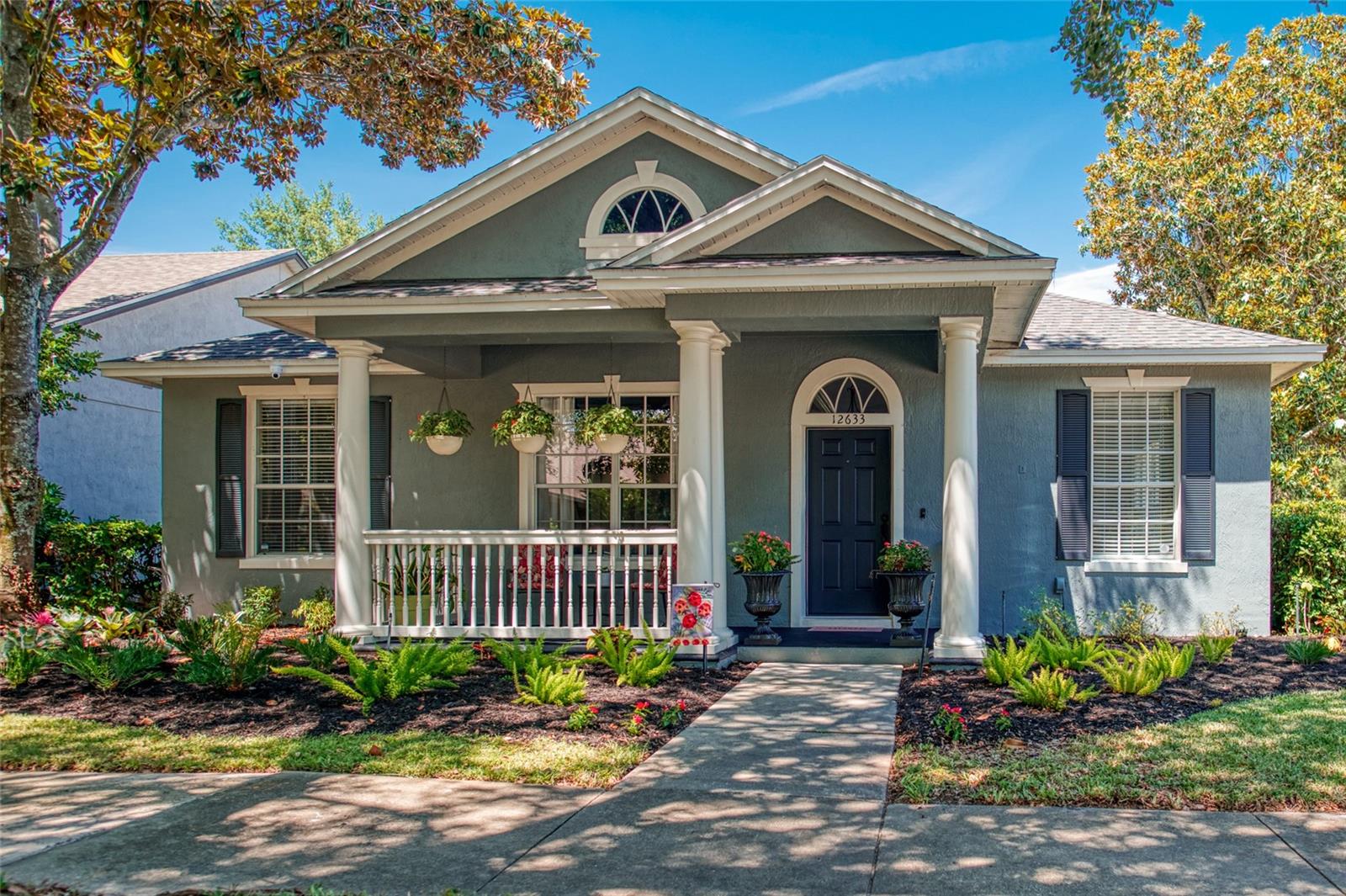 Sitting on a premium corner lot with mature landscaping, this beautiful Kensington model by Ashton Woods is located in the highly sought-after Lakes of Windermere community! Offering nearly 3,000 sq ft, this move-in ready home has been meticulously cared for and features room for a future pool. Recent updates include a new roof (2024), new downstairs A/C (2026), upstairs A/C (2023), upgraded Stainmaster PetProtect carpet (2026), quartz countertops, marble backsplash, cabinet lighting, paver patio, aluminum fencing, and updated landscaping. Inside, you’ll love the open split-bedroom floor plan, crown molding, upgraded flooring, and spacious kitchen with tons of cabinet space and stainless steel appliances overlooking the family room with custom built-in entertainment center wired for home theater. Upstairs 5th bedroom with full bath could also make the perfect theater room, game room, and guest suite. Lakes of Windermere offers a welcoming small-town atmosphere with resort-style amenities including a fishing dock, junior Olympic-size community pool, tennis courts, playgrounds, and organized recreational activities. Ideally located just minutes from Disney, Winter Garden Village, I-4, SR 408, and the Florida Turnpike.