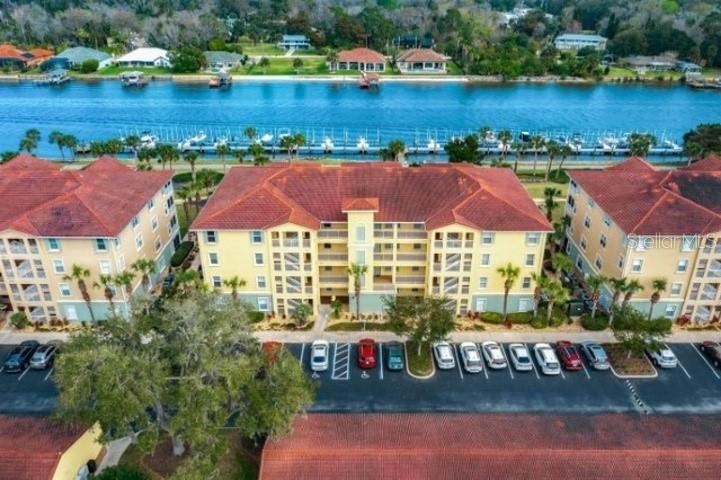 Welcome to waterfront living at its finest in the highly sought-after Canopy Walk community, where breathtaking IntracoastalWaterway views, resort-style amenities, and a peaceful coastal lifestyle come together. This beautifully maintained 3-bedroom,2-bath condo features a spacious open-concept floor plan thoughtfully designed for comfortable everyday living and effortlessentertaining. The well-appointed kitchen overlooks the dining and living areas, creating an inviting space to gather with familyand friends. Quality finishes include granite countertops, ample cabinetry, walk-in closets, and a desirable split-bedroom layoutthat provides privacy for the owner's suite while offering comfortable accommodations for family, guests, or a home office. Newcarpet has recently been installed in all bedrooms, enhancing the home's move-in-ready appeal. Expansive sliding glass doors open to a private screened lanai, where you can enjoy your morning coffee or unwind in theevening while taking in peaceful views of the Intracoastal Waterway. Located on the third floor, this residence offers beautifulwater views and an elevated perspective of the surrounding natural beauty. Additional features include a private detached one-car garage - a highly desirable feature within the community - as well as and convenient access to community amenities.Nestled within the gated Canopy Walk community, this exceptional residence is just minutes from pristine beaches,championship golf courses, shopping, dining, and the scenic Palm Coast trail system. Residents enjoy resort-style amenitiesincluding a zero-entry pool, clubhouse, fitness center, fishing dock, walking and biking trails, outdoor grilling areas, andbeautifully landscaped waterfront grounds. Located directly on the Intracoastal Waterway, this home offers beautiful long-range water views with sights of the community docks and surrounding waterfront landscape. Don't miss the opportunity toown a piece of paradise in one of Palm Coast's most desirable gated waterfront communities. Note: Some photographs havebeen virtually staged to illustrate the property's potential and to help buyers envision furniture placement and roomfunctionality. Furnishings shown are for illustrative purposes only and are not included with the sale.