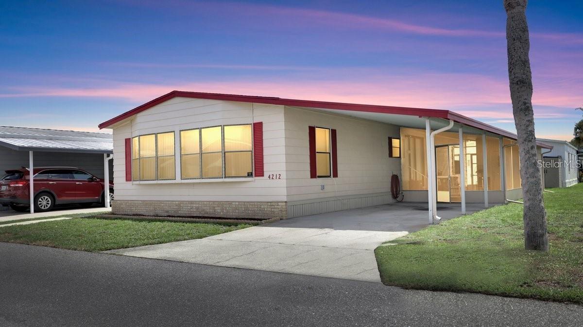 Spacious living plan and Luxurious Kitchen just updated for the top Chef status. As you come in through the covered carport
you'll notice the Newly installed flooring that really shines. There are 2 Living Room areas one of which you could close off for a 3rd bedroom.
Large Master Bedroom and Bath. Skirting around the home has just been replaced for a new look. Not to mention all of the amenities offered
with the community swimming pool, pickleball, tennis courts and putt putt golf course. This property is located on the dog approved residence street, so Fido is in luck. New AC unit was replaced in 2026. You're in close proximity to all the Central Florida
attractions. Hurricane/ Tie Down Straps Replaced 2023. Ceiling fans have been updated w/ remotes.