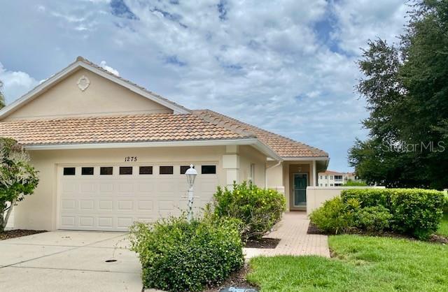 Don't miss this opportunity to own the "LARGEST HOME" in this neighborhood with living area sq footage of 1503 sq ft!! (Taken from the builders blue prints and measuring!!)  Not only that but the largest 2 car garage!!  This garage has an 18 ft wide overhead door (recently replaced) plenty of room for 2 cars or that extra room you are always looking for. This villa home is located in the maintenance free area of Berkshire Place in the "Desirable community of Waterford" and centrally located to everything!  Enter into your home thru gated courtyard with block walls, paver brick patio & walkways, lovely breakfast/party area with beautiful flowering shrubs, colorful butterflies giving pleasure for all. This home is located at the end of the street on the cul-de-sac and gives lots of extra room for your everyday living pleasure AND extra parking for guests! Privacy is at a premium for this lot, the street backs to the county/city park with hundreds of acres of wooded land and walking trails. Then, your home backs to a picturesque small lake/pond with lots of beautiful birds and wildlife then on to the golf course! Next, thru the front door into a "great room" design that is very open and light with volume ceilings, ceiling fans, lots of light from that beautiful Florida sunshine. Choices of location for dining and living then out to a screen lanai for your morning coffee, afternoon cocktail or maybe a nice quiet reading area. Lanai overlooks the lake/pond, then out to the golf course giving long panoramic view of all. Master bed room is spacious w/ensuite bathroom and walkin closet along w/ water/golf course views. Home is a split bedroom plan giving privacy to all. Bedroom 2 is centrally located and has multiple choices of use, office, den, man cave, the list goes on. Laundry is located inside and is very handy and accommodating for all. Bed room 3 is nicely located with sliding glass doors to your outside patio/party area and gives a nice private entry when needed. THEN the Kitchen, probably the busiest room in the house! Nice and roomy, with multiple cabinets, storage, great pullout drawers, etc then complimented with granite counters. Handy breakfast area for your morning paper, Vinyl flooring then out to the courtyard patio thru double sliding glass doors. Home is complimented with laminate and vinyl flooring thru out except Bedroom 2 has carpet. Tile roof was new in 2025, exterior paint 2024, Air conditioner 2021 and newer 18 ft garage door.