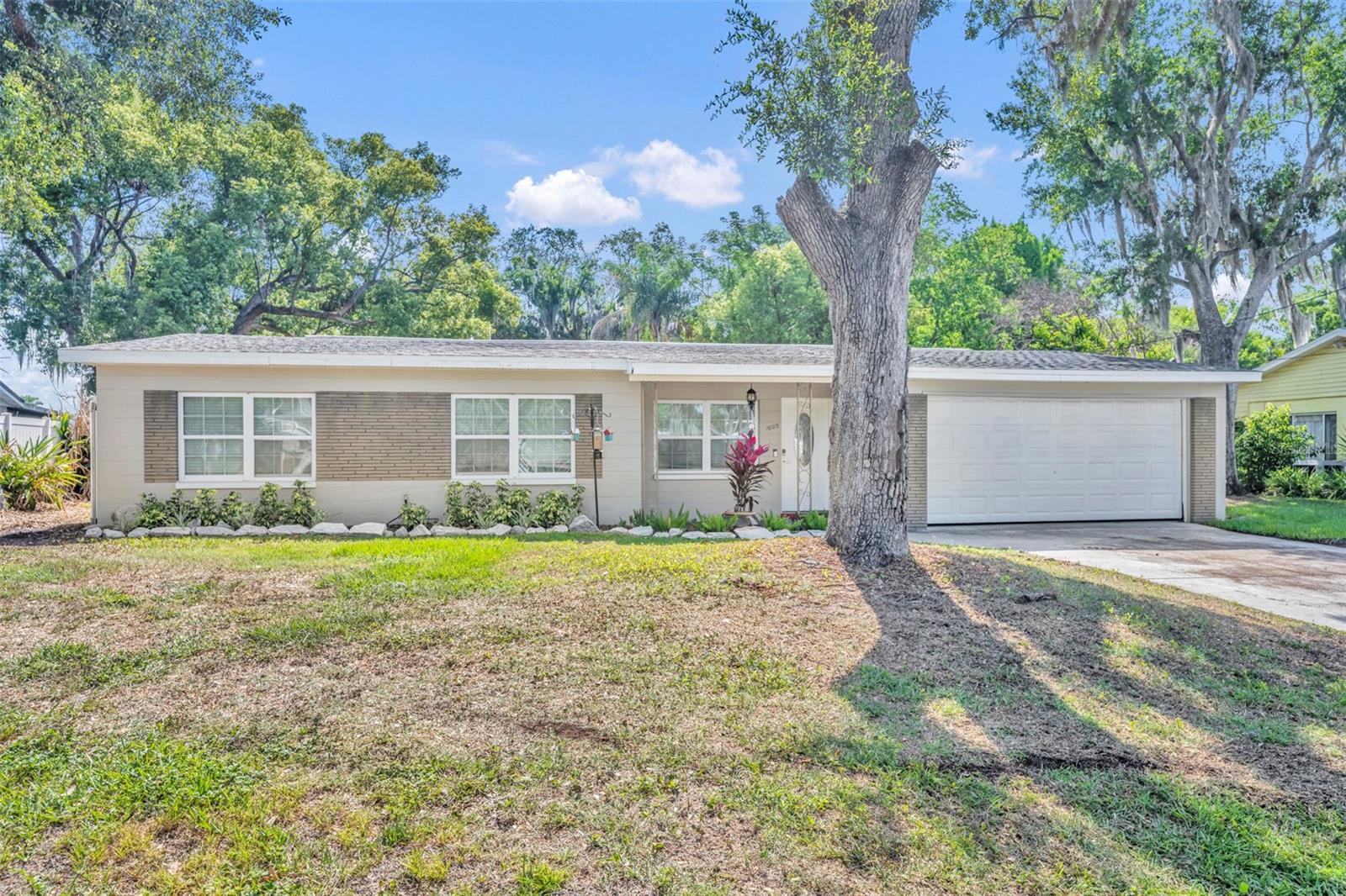 Winter Park waterfront properties offering this combination of lot size, privacy, and long-term potential seldom become available. Tucked away on a quiet dead-end street and held by the same family since 1974, this canal-front property is situated on a canal leading to Lake Bell and enjoys a substantial tree-canopied setting that feels remarkably private while remaining close to everything Winter Park has to offer. Built in 1958, the single-story concrete block residence features 3 bedrooms, 2 bathrooms, approximately 1,467 square feet of living area, and a two-car garage. The floor plan includes generously sized bedrooms, updated bathrooms, open living and dining spaces accented by crown molding and tall baseboards, a cozy family room with a wood-burning fireplace, and an updated kitchen with granite countertops, shaker-style cabinetry, and stainless steel appliances. Additional features include an interior laundry room and a large screened porch overlooking the backyard, dock, and canal. A 4-point inspection completed in June 2026 is available for buyer review and reflects satisfactory conditions in all major categories. Major system updates include a roof replacement in 2019, HVAC replacement in 2021, water heater replacement in 2019, updated electrical panels, and updated water supply plumbing. Orange County Property Appraiser records reflect approximately 0.47 acres with dimensions of approximately 67 x 207 x 133 x 224 feet. Preliminary measurements using Orange County Property Appraiser mapping tools suggest an estimated upland area in excess of 15,000 square feet, providing ample space for outdoor living, recreation, gardening, or future improvements. Whether enjoyed as-is, thoughtfully renovated, expanded, or completely reimagined as a custom waterfront residence, the property’s greatest asset is its exceptional setting, water access, and generous land area. Zoned for Hungerford Elementary School, College Park Middle School, and Edgewater High School, which earned an A school grade in 2025, the property also benefits from convenient proximity to Winter Park’s renowned shopping, dining, parks, entertainment, major roadways, and Downtown Orlando.