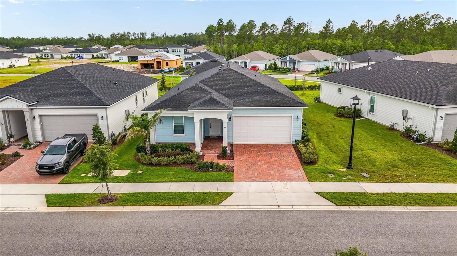 Effortless Florida Living in Reverie!

What an absolute steal in the highly sought-after 55+ Reverie community of Palm Coast! Built in 2024, this Charlotte model offers over 2,000 square feet of thoughtfully designed living space and is priced below builder cost due to the seller’s relocation.

Featuring 2 spacious bedrooms, 2.5 bathrooms, and a versatile flex room with double doors that can easily serve as a 3rd bedroom, home office, hobby room, or den, this home offers the flexibility today’s buyers are looking for. Soaring ceilings and an open-concept design create a bright, airy feel, while the expansive living room flows seamlessly into the kitchen, making it perfect for entertaining family and friends. Additional highlights include a large walk-in pantry, convenient built-in desk area, and a fully screened lanai ideal for relaxing or enjoying Florida’s beautiful weather year-round.

The spacious primary suite offers a large walk-in shower, generous storage, and a peaceful retreat at the end of the day.

This is an exceptional opportunity to own in one of Palm Coast’s premier active-adult communities. Enjoy a true low-maintenance lifestyle with HOA amenities that include lawn care, high-speed internet, resort-style pool, clubhouse, pickleball courts, fitness facilities, social activities, and more.

Why wait to build when you can move right into this nearly new home and enjoy all that Reverie has to offer? Seller’s relocation is your opportunity—schedule your showing today and discover why this home is such an incredible value!