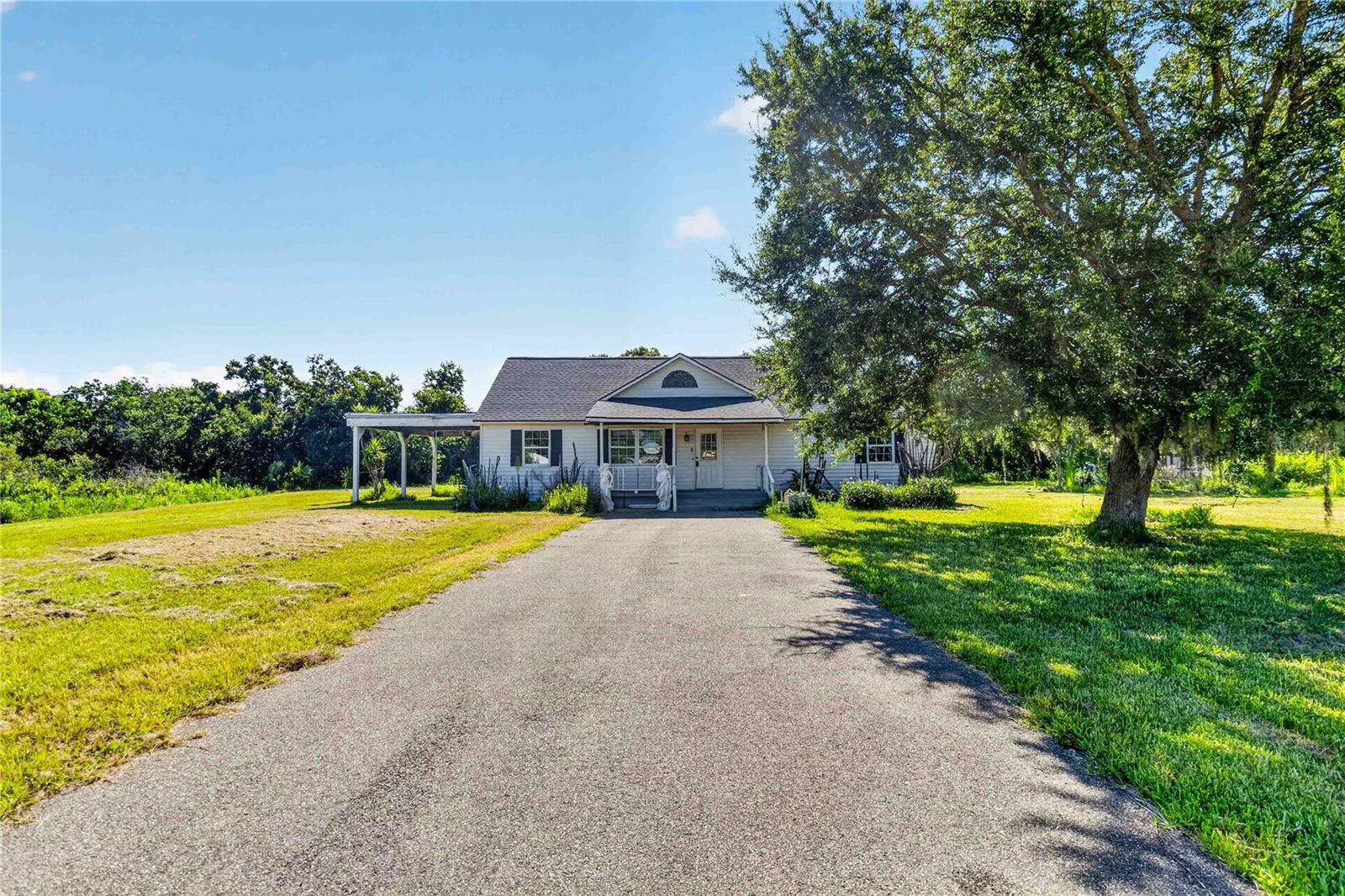 It's not every day you see something like this. This one is truly a Game Changer!! 2.6 ACRES of BEAUTIFUL property tucked in providing you the ultimate privacy yet minutes to EVERYTHING. This 3-bedroom 2 story home sits in the middle of the property with 2 large sheds in the far end of the property. Primary bedroom on the first floor with 2 additional bedrooms and a loft area on the second floor. Home is backed to a conservation area. Enjoy beautiful nature views with quiet breeze as you start your day and end your night in tranquility. Side of home has a pond view. The Best part about this property is there is NO HOA!! So, if you been looking for that something special to call Home this is it right HERE!