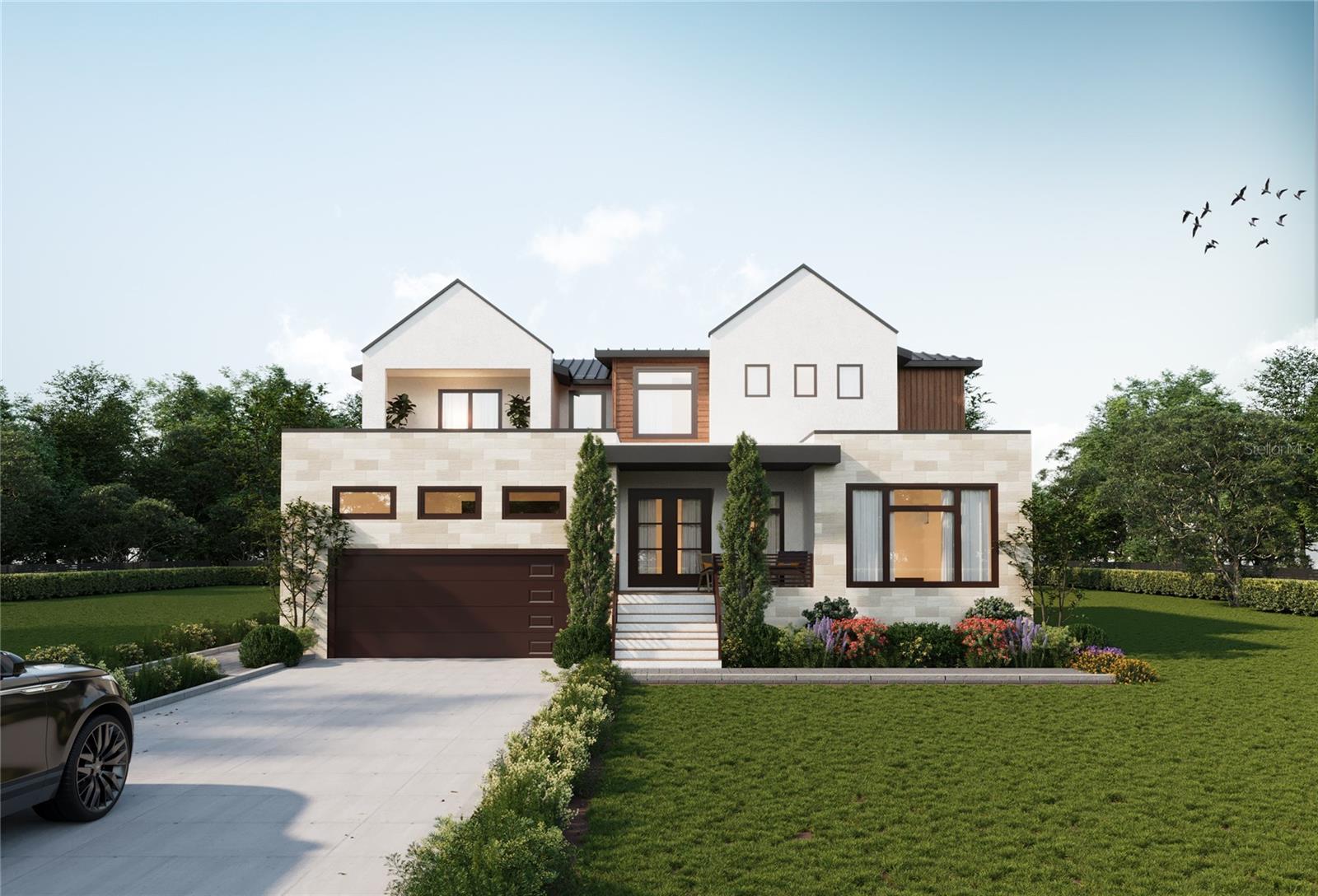 Under Construction. Experience refined waterfront living in this brand-new construction expertly crafted by the highly regarded Bay to Bay Group, ideally positioned in one of Northeast St. Petersburg’s most desirable locations. Offering approximately 3,800 square feet, this thoughtfully designed residence features 4 bedrooms, 4 full bathrooms, a powder room, and a dedicated office. Wide bayou views and direct access to Tampa Bay define the experience, offering effortless boating to open water and the Gulf beyond. The home’s striking curb appeal sets the tone, defined by clean architectural lines, layered textures, and a refined modern coastal aesthetic that creates a strong and memorable first impression. From the moment you enter, the home makes a statement with a custom glass-enclosed wine display tucked beneath the staircase, serving as an architectural focal point and setting the tone for the level of design carried throughout. The interior is filled with natural light, highlighted by expansive windows that frame tranquil water views and create a seamless connection between indoor and outdoor living. The open-concept layout is anchored by a designer kitchen that truly elevates the home, featuring a dramatic waterfall-edge island wrapped in full slab stone, a statement range hood, custom cabinetry, and a premium Monogram appliance package, including a gas range, double wall ovens, and a built-in wine column. A well-appointed butler’s pantry offers additional prep space and storage, enhancing both functionality and entertaining. A grand great room with a fireplace opens onto the covered lanai, where a spa-like pool and outdoor kitchen create the ultimate setting for entertaining or relaxing, all positioned to take full advantage of the water views. The primary suite is ideally located on the first floor, offering privacy and ease of living while delivering a true retreat-like experience. The spacious bedroom is complemented by a spa-like bathroom featuring a freestanding soaking tub, a large walk-in glass shower, dual vanities, and elevated finishes throughout, along with a generous walk-in closet designed for both function and style. Upstairs, a large loft/bonus living area provides an ideal secondary living space, lounge, or media area, with access to a private balcony capturing water views over the pool. This level also includes a secondary primary suite with its own ensuite bath, along with two additional bedrooms connected by a Jack and Jill bathroom, offering a functional and flexible layout for guests or family. Additional highlights include 10-foot ceilings, 8-foot interior doorways, a wet bar, mudroom, and thoughtfully selected designer lighting throughout, including statement chandeliers and elevated fixtures. The home is equipped with natural gas, including a tankless gas water heater, and also prioritizes energy efficiency with Icynene attic insulation, pre-installed low voltage wiring, efficient LED lighting, and a high-efficiency air conditioning system. Perfectly positioned just minutes from downtown St. Petersburg, this waterfront residence offers a rare opportunity to enjoy new construction and a prime location, all within one of St. Pete’s most esteemed waterfront communities.
