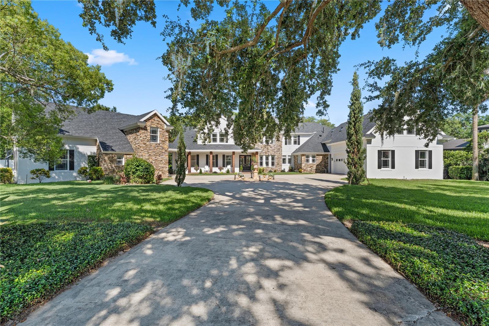 EXPERIENCE THE PINNACLE OF LUXURY LIVING IN THIS  ONE-OF-A KIND  RESORT-STYLE HOME
This stunning Windermere 1.86-acre LAKE FRONT residence is a true showstopper, blending timeless elegance with resort-caliber amenities, all within a very short distance of one of Orlandos top rated Private International schools, and with the added benefit of NO HOA. Step inside to soaring ceilings, expansive living spaces, and a flowing open-concept layout designed for both lavish entertaining and everyday comfort. This 6 bed 6.5 bath home is a true entertainer's dream.  At the heart of the home is a gourmet chef’s kitchen, showcasing a double oven with 6-burner gas cooktop, dual islands topped with quartz countertops and back splash, and premium custom finishes throughout. Enter into a well-appointed utility room featuring a built-in fridge/freezer a second dishwasher, and ample cabinetry, with generous counter space. An integrated laundry chute from the upper level adds to your convenience. The kitchen flows seamlessly into a breathtaking family room featuring 23 foot cathedral ceilings, floor-to-ceiling windows, and a custom-made gas fireplace. Throughout the main living areas, engineered hardwood flooring adds to the warmth and elegance. The main living areas are enhanced by Lutron lighting, a central vac system, and a premium 8 zone music system with integrated speakers extending to the poolside. Elegant owner’s suite featuring a spa-like bathroom and versatile bonus room perfect for a second office, nursery, or creative studio. There is also second en-suite bedroom on the ground floor. Upstairs, you'll find four generously sized double bedrooms, including one that could easily serve as a secondary primary suite. Three modern bathrooms provide ample comfort and convenience for family and guests. A dedicated office offers the perfect space for working from home .Completing the upper level is a spacious bonus area, ideal as an additional family lounge or media room, which opens onto another private terrace with stunning views of the lake.  The home benefits from a separate fully self-contained in-law apartment with its own private entrance, kitchen, bath, and flexible living/sleeping area, ideal for multigenerational living or extended guest stays. Outside experience true resort-style living designed for recreation, relaxation, and entertaining , with amenities rarely found in residential homes. Stay active without ever leaving home thanks to a full-size lighted pickleball/basketball court. A large sand volleyball court adds a casual, beach-style atmosphere with picturesque views of the lake. Multiple lounging and entertaining areas both covered and open-air, creating a perfect setting for everything from weekend brunches to sunset cocktails. A beautiful south-facing pool with fountains, with newly upgraded equipment in 2024. Huge oversized spa, for total relaxation. A new outdoor kitchen 2025 for those laid-back barbecues. Beyond the pool area, the boat dock sits on the private tranquil waters of Lake Cypress, complete with electronic boat and jet ski lift, offering access for all water enthusiasts. The five-car garages includes an air-conditioned bay, ideal for use as a personal gym, studio, or collector’s showcase.
The home benefits from multiple upgrages eg NEW ROOF 2024, TOTAL REPIPE/3 NEW GAS WATER HEATERS 2025. Every inch of outdoor space has been curated to deliver an exceptional lifestyle experience that feels like your own private resort.