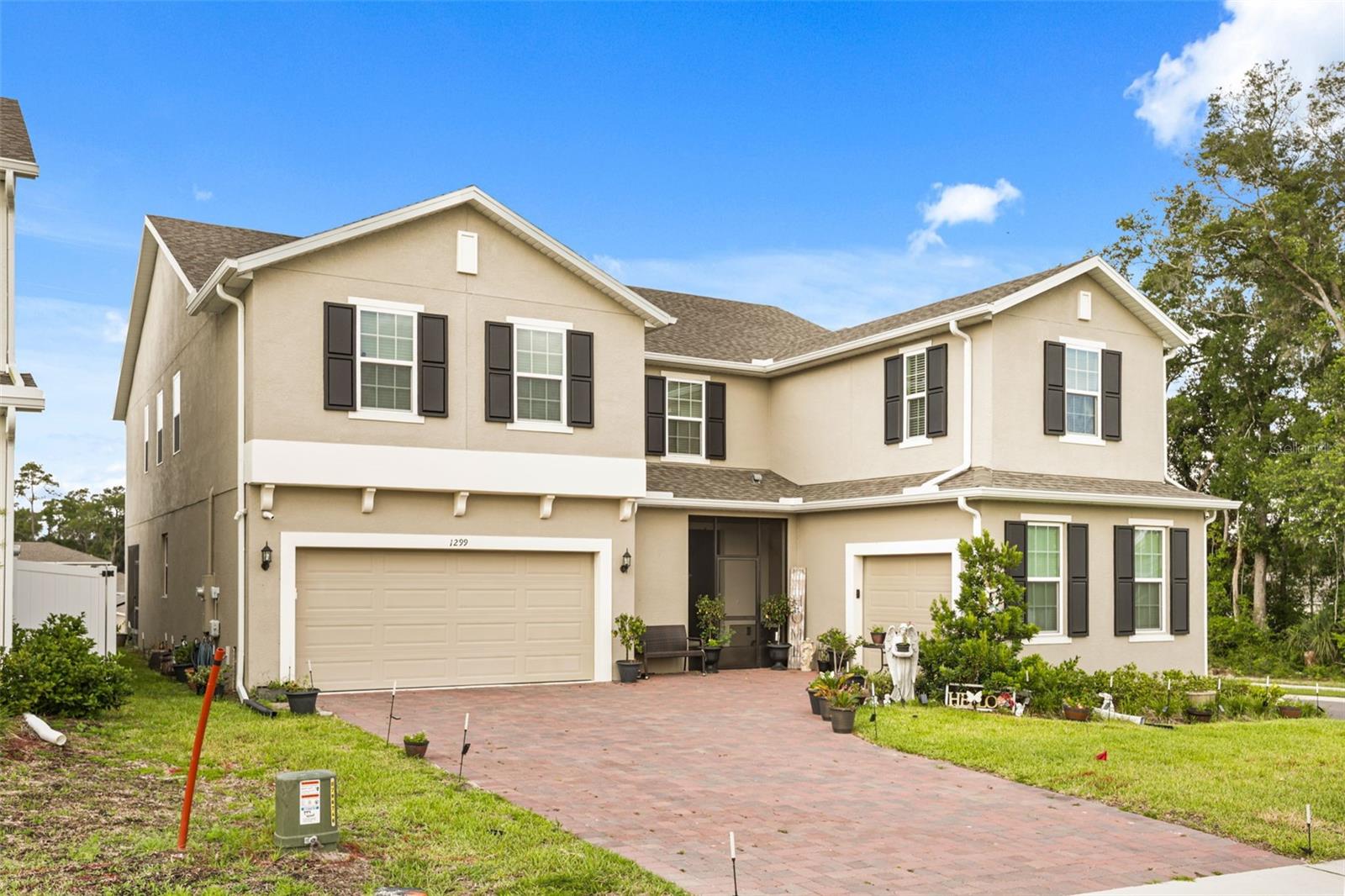 Welcome to 1299 Woodline Drive in the desirable Beresford Woods community of DeLand. Built in 2024, this impressive smart home offers over 4,400 square feet of thoughtfully designed living space, making it the perfect fit for large families, multi-generational living, or anyone who simply wants room to spread out.

Featuring 5 spacious bedrooms, 3.5 bathrooms, 2 versatile flex rooms, and a massive 3-car garage, this home combines modern convenience with exceptional functionality. The expansive floor plan includes multiple living and gathering areas, dual staircases, and flexible spaces ideal for home offices, playrooms, fitness areas, or guest accommodations.

Designed for today's lifestyle, the home's smart features can be controlled directly from your smartphone, providing convenience, security, and efficiency at your fingertips. Situated on a premium corner lot in a peaceful neighborhood, you'll enjoy the benefits of newer construction, contemporary finishes, and a layout built for both everyday living and entertaining.

With its incredible size, modern design, smart-home technology, and versatile multi-generational floor plan, this home delivers the space, comfort, and lifestyle today's buyers are searching for. A rare opportunity to own a nearly new, move-in-ready home in one of DeLand's most sought-after communities.