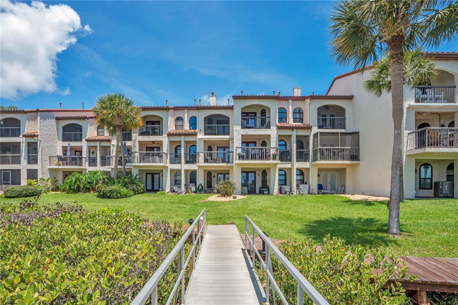 Welcome to Paradise at Marina Bay, one of New Smyrna Beach's most exclusive waterfront communities. This private enclave of just 20 residences offers an exceptional coastal lifestyle with premier amenities, including a swimming pool, tennis courts, clubhouse, and private marina—all nestled within the highly sought-after Center Island location.
Just minutes from Flagler Avenue, the beach, Canal Street, dining, shopping, and entertainment, this beautifully renovated residence combines luxury, convenience, and breathtaking waterfront living. The home features 3 bedrooms, 3.5 bathrooms, and a 1.5-car garage, with a thoughtfully designed open floor plan that showcases spectacular 180-degree views of the Intracoastal Waterway and marina from five private terraces.
Extensively, recently and tastefully upgraded, the residence includes new impact-rated windows and doors, updated electrical and plumbing systems, a new roof with energy-efficient spray foam insulation, a stunning quartz kitchen, whole-house premium water filtration system, and two custom Murphy beds. Every detail has been completed, allowing you to move in and immediately enjoy the lifestyle you deserve—without the need for additional investment.
Marina Bay stands apart from any other community in the area, offering a rare combination of prime location, outstanding amenities, low HOA fees, natural beauty, and exceptional value. Living on Center Island means easy golf-cart access, minimal beach traffic, and close proximity to some of New Smyrna Beach's finest restaurants, shops, and services.
Bring your family and begin enjoying the very best of waterfront living in New Smyrna Beach. Everything you've been looking for is right here.