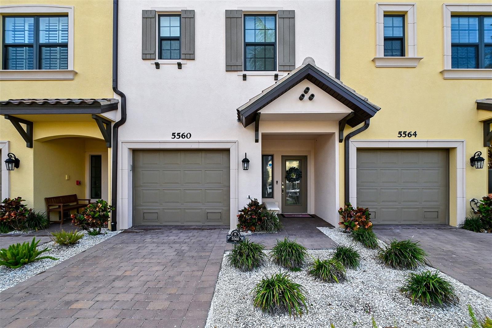 Beautiful luxury townhome with contemporary flair located only minutes from Siesta Key. This 3-story residence offers affordable luxury and maintenance-free living in a premier location on the shores of Phillippi Creek, where you are surrounded by 10 acres of stunning tropical foliage and landscaping. Rarely available, this is your chance to live in an open concept space with high ceilings, designer kitchen features, spectacular interior details and stylish bathroom fixtures. Upon entering this 3-bedroom, 3-bathroom home, you will fall in love with the bright, open floorplan featuring high-end finishes and an abundance of natural light. Enjoy relaxing on one of two lanais; one on the ground floor with outside access and another one upstairs with stunning views. There are stairs and a private elevator for your convenience as well as an oversized garage with plenty of room to store kayaks, golf clubs, beach chairs, fishing poles and more. The Phillippi Harbor Club Rackominium and Marina is right next door for your boating pleasures. There is also an onsite resort-style pool and kayak launch for active pursuits. Additional amenities include a clubhouse, dog park, fitness center and lighted boardwalk. You are minutes away from downtown Sarasota, fine dining, shopping, outdoor activities and the area’s famous beaches. Enjoy the best of Sarasota luxury living in the secluded, gated waterfront community of Phillippi Landings.