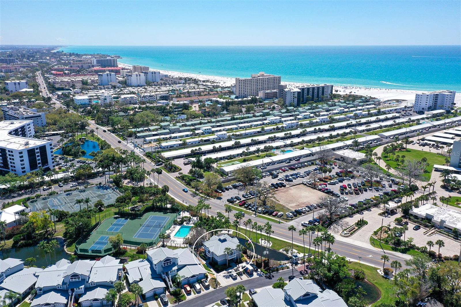 Welcome to the world-famous Siesta Key! Now available a second-floor one-bedroom, one-bath condominium in the desirable Gulf and Bay Club Bayside. This particular condo had zero flood or storm damage. This home is just waiting for your personal touch! Enjoy direct deeded beach access just across the street to Siesta Key Beach and live a true resort-style life with wonderful amenities at your fingertips. An open floor plan greets you with tile on the diagonal, a spacious living/dining area, and a balcony overlooking the community pool. The unit is complete with a private one-car garage, indoor laundry with a brand-new stackable washer and dryer, and turnkey furnished and ready for you or your guests.  Gulf and Bay Club Bayside features: Two resort-style pools Tennis and pickleball courts Newly renovated fishing dock Walking paths, boat loading zones, and four BBQ areas Clubhouse for private parties and events. This weekly-rental-friendly community also offers onsite management (directly below the unit), making it a great income opportunity for investors or those seeking a snowbird property. Location cannot be beat you just cross the road for beach access or take the free trolley to explore Siesta Key Village or South Siesta! Live the island lifestyle at Gulf and Bay Club Bayside. Tenant occupied best showing time Saturday but with enough notice we can manage a showing. Must be scheduled and approved by tenants.