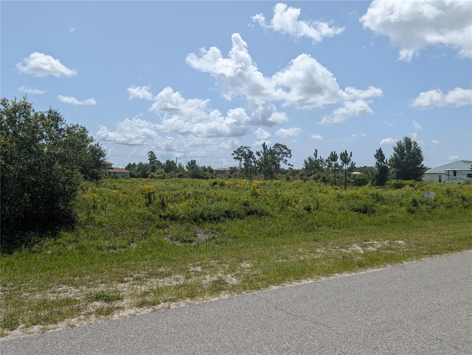 Exceptional 1/2 Acre Lot in Indian Lake Estates – Prime Location on a Great Street! Discover the perfect place to build your dream home in the highly sought-after Indian Lake Estates! Situated on one of the best streets in the community, this beautiful half-acre lot offers access to the community water system (no well required) and nearby electric service—making it ready for your custom build....Indian Lake Estates is a unique lake and golf community nestled about 20 miles east of Lake Wales in Central Florida. Centered around the stunning 7,500- acre Lake Walk-In-Water—renowned statewide and nationally for world-class bass fishing—this neighborhood is a true hidden gem. Residents enjoy exclusive lake access including a beach, boat ramp, marina, and the longest freshwater fishing pier in Florida. The lakeside pavilion offers propane grills and covered picnic areas for relaxing afternoons by the water....The community boasts impressive amenities including: An 18-hole golf course; Basketball and tennis courts; A 23,000 sq.ft. clubhouse with restaurant; Library, churches, post office, and fitness room, Pro shop and more...Nature lovers will appreciate the abundant wildlife, including deer, turkey, cranes, and a wide array of birds. Enjoy the peaceful country atmosphere with easy access to modern conveniences...Perfectly located just over an hour to Orlando, Disney World, and Tampa; Close to Bok Tower Gardens (National Historic Landmark), Minutes from Westgate River Ranch Resort, a 1,700-acre dude ranch with rodeos, airboat rides, horseback riding, glamping, and more...Whether you’re looking to build your forever home, a seasonal getaway, or an investment property, Indian Lake Estates offers an incredible lifestyle surrounded by nature, recreation, and charm. Come explore Polk County’s best-kept secret—Indian Lake Estates!