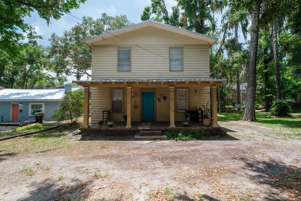 Investment opportunity just steps from the University of Florida! This spacious two-story home features 3 bedrooms and 1 bathroom and is **leased through July 2027**, providing immediate, reliable rental income from day one. Inside, the home offers beautiful wood floors, an updated kitchen, generous living areas, and oversized bedrooms that are highly desirable for the UF rental market. The fenced backyard adds privacy and outdoor living space for tenants to enjoy. Located in an Opportunity Zone, this property also offers outstanding long-term potential. Whether you choose to continue generating rental income, expand the existing home, or explore future redevelopment opportunities (subject to local zoning and approvals), the possibilities are extensive.