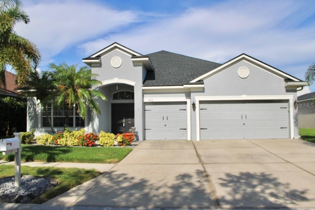 Welcome to this four-bedroom, three-bathroom home, located in the wonderful gated community of Mira Lago. With more than 3,000 square feet of living space plus a three-car garage, can you say upgrades upgrades upgrades… This is the house you’ve been looking for., this beautiful lakefront property won’t last. The majority of your living area is on the ground floor, so you won’t need the stairs unless you’re taking advantage of the big loft upstairs, which is currently being utilized as a full functional gym. Upon entering the home you have a large, living room and dining room combination. The heart of the home is the open concept kitchen and family room. The kitchen and bathrooms have granite countertops, LG stainless steel appliances, an eat-in area and a big breakfast bar centered in the middle of the kitchen. Just off the kitchen is the laundry room with a sink and above head wood storage cabinets along with wired storage racks. The kitchen also has access to the three-car garage, so you can walk right in with your groceries. The family room has sliding glass doors leading to the covered patio overlooking the beautiful lake– great for outdoor living. You have the privacy of no rear neighbors and completely fenced-in backyard. The bedrooms are laid out in a three-way split plan. Two guest bedrooms and a full guest bathroom are located off the family room. In one corner of the house you have a junior master suite that faces the rear of the home, complete with its own private, full bathroom and private entrance perfect for “mother in law suite” The master bedroom is on the other corner. It has two walk-in closets, and the large master bathroom features a garden tub, separate shower stall and dual sinks. Living in Mira Lago offers many great amenities including a community pool, basketball court, and clubhouse for your use. Come make this home yours today!