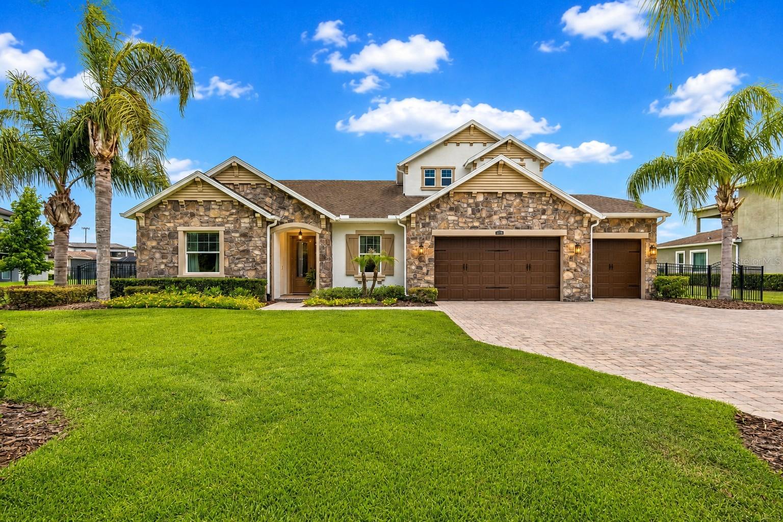 Virtually Staged. RARE FLOOR PLAN in the award-winning gated community of CORDOBA ESTATES -  NEW INTERIOR PAINT / NEW EXTERIOR PAINT / NEW CARPET. Built by the renown STANDARD PACIFIC BUILDER - 5 bedrooms, 4 baths, a 3-car garage, OFFICE/den, FLEX ROOM, and upstairs BONUS ROOM w/FULL BATH across 3,543 square feet of easy one-story living. This home is ENERGY STAR certified and genuinely ENERGY EFFICIENT, built to the Florida Energy Efficiency Code with double-pane Low-E windows, SEER 15 cooling, an electric heat pump, R-30 attic insulation, solid concrete block construction. Pour your coffee, look out the window, and take in a serene POND view with protected CONSERVATION beyond - pure stillness. PREMIUM OVERSIZED CORNER LOT, more than half an acre, framed by CONSERVATION across the front and back, so you enjoy NO NEIGHBORS FRONT OR BACK. Pull through the gates after a long day, past the manicured landscaping, and feel it right away - that settled, exhale feeling of being home. Inside, an open-concept, split-bedroom layout flows beneath high-volume ceilings and elegant tray ceilings. The gourmet kitchen is the heart of it all - GAS COOKTOP, DOUBLE OVENS, luxurious CAMBRIA QUARTZ counters throughout, DESIGNER CABINETS, WALK-IN PANTRY and a large center island where you will gather with your family and friends and create new memories. Retreat to the light filled private primary suite -  breathtaking view, HIS & HERS WALK-IN CLOSETS, and a large walk-in shower where you can sing as loud as you want.  Just off it sits a versatile FLEX ROOM - imagine it as a nursery steps from your room, a private home OFFICE, a craft room, or an oversized extra closet. A separate OFFICE/den with tray ceilings gives you another quiet place to focus. Upstairs, a private BONUS ROOM with a full bath and large closet becomes whatever you need most - a second suite, a guest retreat, a game room, or a home theater. In the backyard, the oversized lot gifts room to add the pool you have always wanted, extend the patio for weekend dinners, even add a gazebo for shade and slow evenings outside. The little ones have space to run and play, and the furry ones have even more room to roam. Add a 3-car garage with epoxy flooring, brick paver driveway and walkway, a fully fenced yard, fire pit, irrigation. Pool pre-plumb is already in place, and the home sits in Flood Zone X. CORDOBA ESTATES wraps it all in gated privacy and resort-style amenities - offers deed restrictions, golf carts, community pool, dog park, park, playground, sidewalks, and tennis courts, all within a peaceful GATED setting close to Tampa Premium Outlets, dining, shopping, entertainment, Moffitt, Tampa International Airport, I-75, and I-275. When it's gone, it's gone!