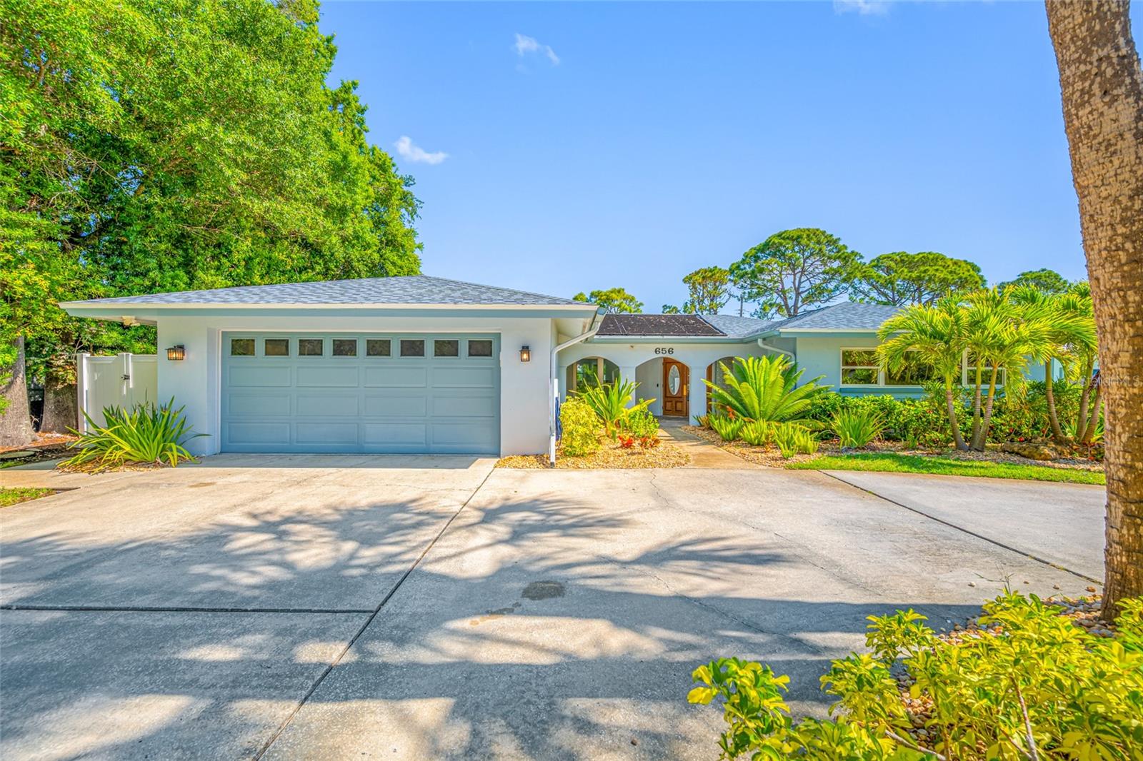 Golf course views define this completely renovated Belleair home, perfectly positioned on the 16th fairway of Pelican Golf Club. A complete interior renovation and professionally redesigned landscaping have transformed the property into a beautifully finished home just 3 miles from the Gulf beaches. With no HOA fees, no flood insurance required, and hurricane-impact windows throughout the main living areas, this home offers exceptional peace of mind.

Large sliding glass doors open to the screened, heated pool, where expansive fairway views become the backdrop for everyday living and entertaining. Professionally redesigned landscaping, premium privacy fencing, and a smart irrigation system create a private backyard retreat while preserving the openness and beauty of the golf course setting.

Inside, every major living space has been thoughtfully updated. New laminate flooring flows throughout, complemented by fresh designer paint, custom kitchen cabinetry, quartz countertops, and new Samsung stainless steel appliances. A pass-through window connects the kitchen directly to the pool, making indoor-outdoor entertaining effortless.

Both bathrooms have been completely renovated with custom tile, quartz countertops, new vanities, and a soaking tub. The laundry room has also been upgraded with built-in cabinetry, a utility sink, and quartz countertops. A whole-home water softener adds everyday convenience.

Designed with accessibility in mind, the home features 36-inch doorways throughout and a roll-in shower, offering enhanced mobility without compromising style or quality. Thoughtfully integrated into the home's design, these features provide lasting comfort and flexibility for a wide range of lifestyles.

The sale includes all indoor and outdoor furnishings and all appliances, offering a truly move-in-ready opportunity.

Additional improvements include a 2018 roof, 2022 HVAC system, professionally redesigned landscaping, smart irrigation, and no HOA fees.