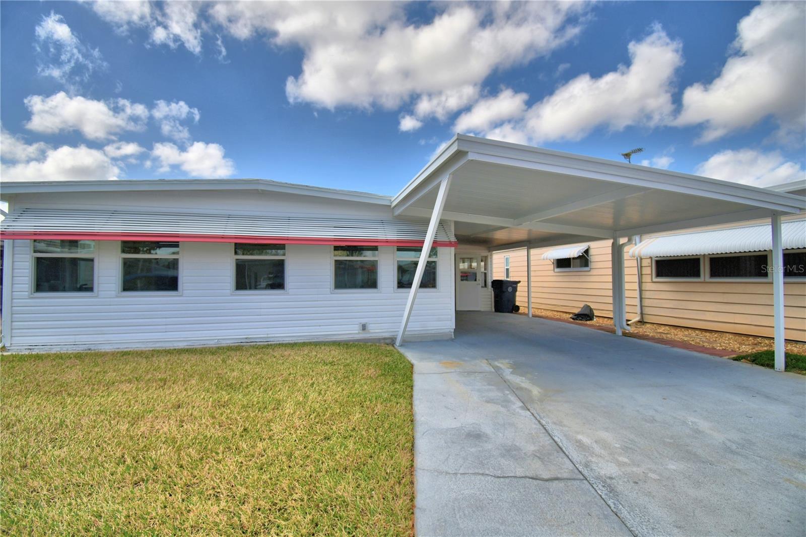 Welcome to Ariana Shores, a vibrant and active 55+ waterfront community!
This well-maintained 2-bedroom, 2-bath home offers an inviting open floor plan designed for comfortable Florida living. The kitchen features a large island with breakfast bar seating and prep space, seamlessly opening to the dining and living areas — perfect for everyday living and entertaining.
A bright and spacious Florida room, surrounded by windows, fills the home with natural light and offers flexible space to use as a sitting area, hobby room, office, or additional entertaining space.
The primary suite is generously sized and includes a very spacious en-suite bath. The second bedroom is also oversized, with a conveniently located guest bath just across the hall — ideal for visitors.
This home is being sold furnished, with a few personal exceptions, making it truly move-in ready.
Residents of Ariana Shores enjoy an active, friendly lifestyle with amenities that include a Heated community pool, a Clubhouse with social activities, Shuffleboard courts, Access to beautiful Lake Arietta, a private fishing dock and boat ramp.
The purchase price includes the $30,000 co-op share, which is returned to you when you sell, adding exceptional value.
Call today to schedule your private showing and start enjoying the Florida lifestyle you’ve been waiting for!