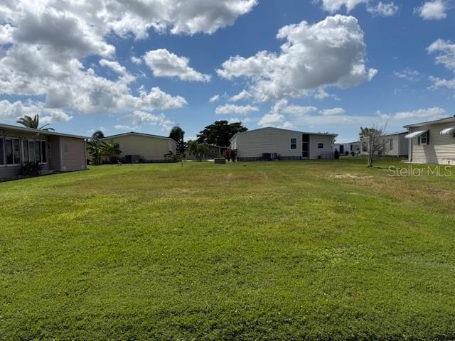Vacant lot in a vibrant 55+ community located near the boat ramp and across from the La Casa-owned pristine 40 acres!  La Casa offers the ultimate Florida lifestyle.  We have 974 home sites nestled among a variety of native trees with spacious common grounds surrounding our eight lakes. La Casa is located between Sarasota and Fort Myers, and is a boater's dream with access to the Gulf of Mexico. It is convenient for shopping, sightseeing, golfing, fishing, and boating, as well as all the culture and elegance the Southwest Florida area is noted for. La Casa may have the best pools in the area. Our crown jewel is an extremely large, 40 X 60-foot swimming pool that is kept at a perfect 87 degrees. Our smaller 20 x 40 pool is quietly nestled between the clubhouse and the Activity Building. Both pools have adjacent hot tubs which are ideal for soaking muscles that are tired from golfing or tennis. Wireless Internet (Wi-Fi) is available at the Clubhouse, Activity Building, and Recreation Hall area where these pools & spas are located, so you can catch some rays while you catch up on your email! Sound enticing? Come for a visit to this self-contained oasis and see for yourself why La Casa is the ultimate destination for both snowbirds and year-round residents!
