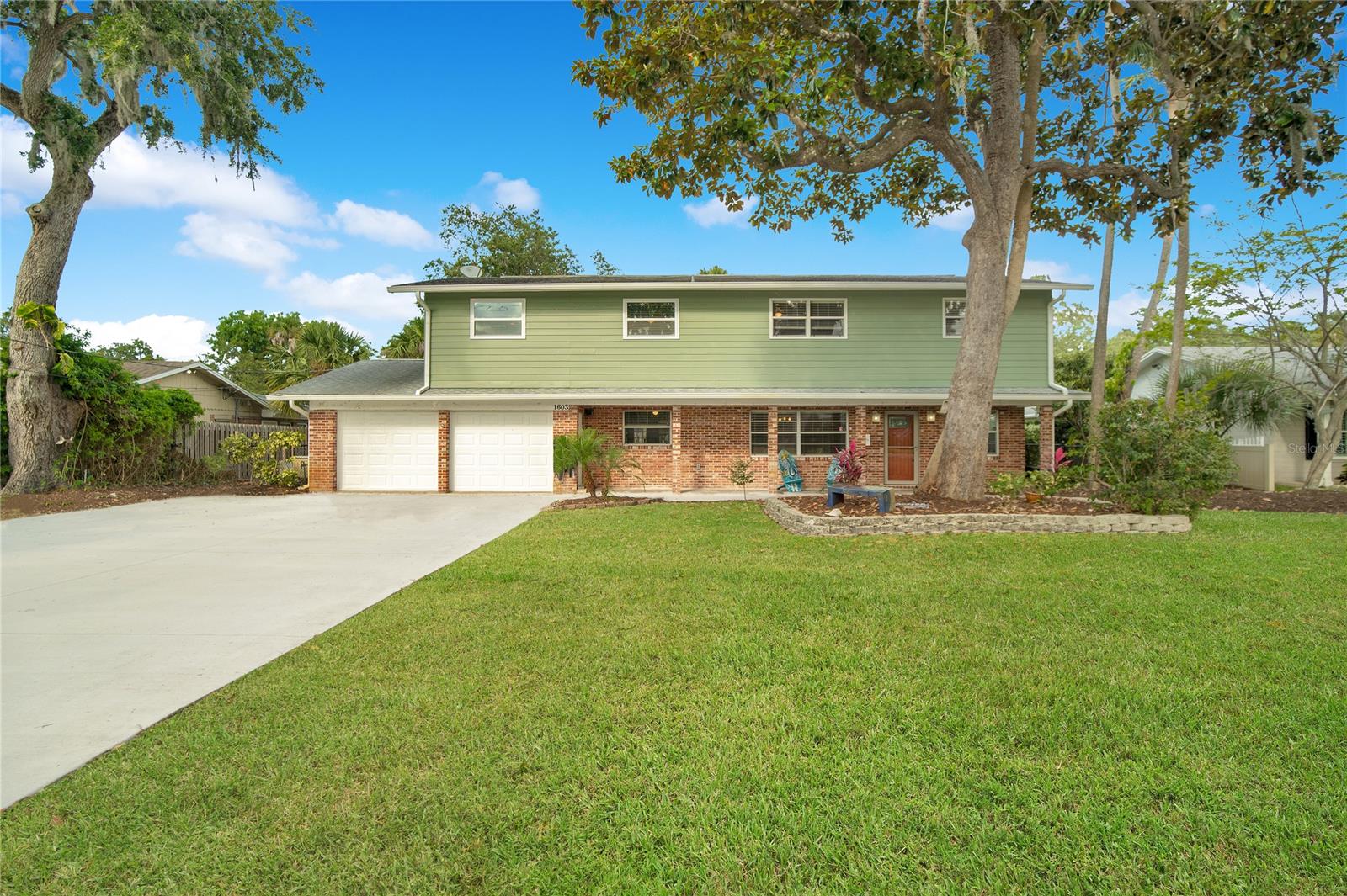 Welcome to a stunning riverside retreat—the perfect family home. A spacious 4 bedroom, 3 bathroom home with a built-in screened pool and large Fenced in backyard. Covered Lanai and spa, make for a great outdoor living space. This is one of the only true four-bedroom homes available on the market, with one of the best master suites in all of New Smyrna Beach. Set on nearly  .5-acre, the property presents an additional entry at the rear, offering an excellent opportunity for a mother-in-law suite or  extended outdoor oasis. The home showcases an open and airy living area. Complemented by a secondary family room. Oversized Kitchen with Stainless steel appliances,Granite counter tops & 42” Solid Wood Cabinets. Directly off the kitchen and family room you will find an indoor oversized laundry room with access to Lanai.  A full bathroom is conveniently located on the ground floor, while all bedrooms reside upstairs. The master suite, complete with a walk-in closet, updated full bathroom & seating room. Stand as a prime feature of the residence. 2 car garage, additional parking in the rear. Ac/Heater October 2021….. Tankless water heater. ;Water: City