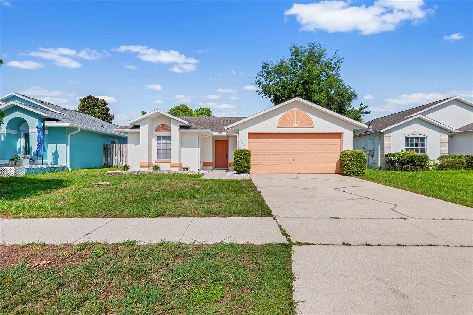Welcome to this professionally cleaned 3-bedroom, 2-bath home tucked away on a quiet, sidewalk-lined street in the heart of Orlando. This desirable location is just minutes from shopping, dining, and world-renowned theme parks. As soon as you enter this home you notice that the airy floor plan offers both privacy and functionality, with an inviting open-concept kitchen, dining, and living area perfect for everyday living and entertaining. From the living room, the sliding glass doors open to the screened-in porch creating a relaxing space to enjoy your morning coffee or afternoon/evening meals. The spacious primary suite features a large walk-in closet and sliding glass doors leading to the screened porch, creating a peaceful retreat. The primary bathroom offers plenty of space with a large walk-in shower, separate soaking tub, and oversized vanity/sink area. Step outside to enjoy the fully fenced backyard, ideal for pets, play, or relaxing outdoors. The easy-care lawn and yard have seen recent updates for low-maintenance living. An added bonus: the extra refrigerator in the garage works great. This home is very clean inside and out; however, the carpet does need some care as there is some staining that was not able to be removed and a couple of areas where small pieces are missing by the dining wall. The roof was replaced in 2018, and the AC was replaced in 2025. With a little loving care, this well-maintained home will provide years of comfort and convenience — schedule your showing today!