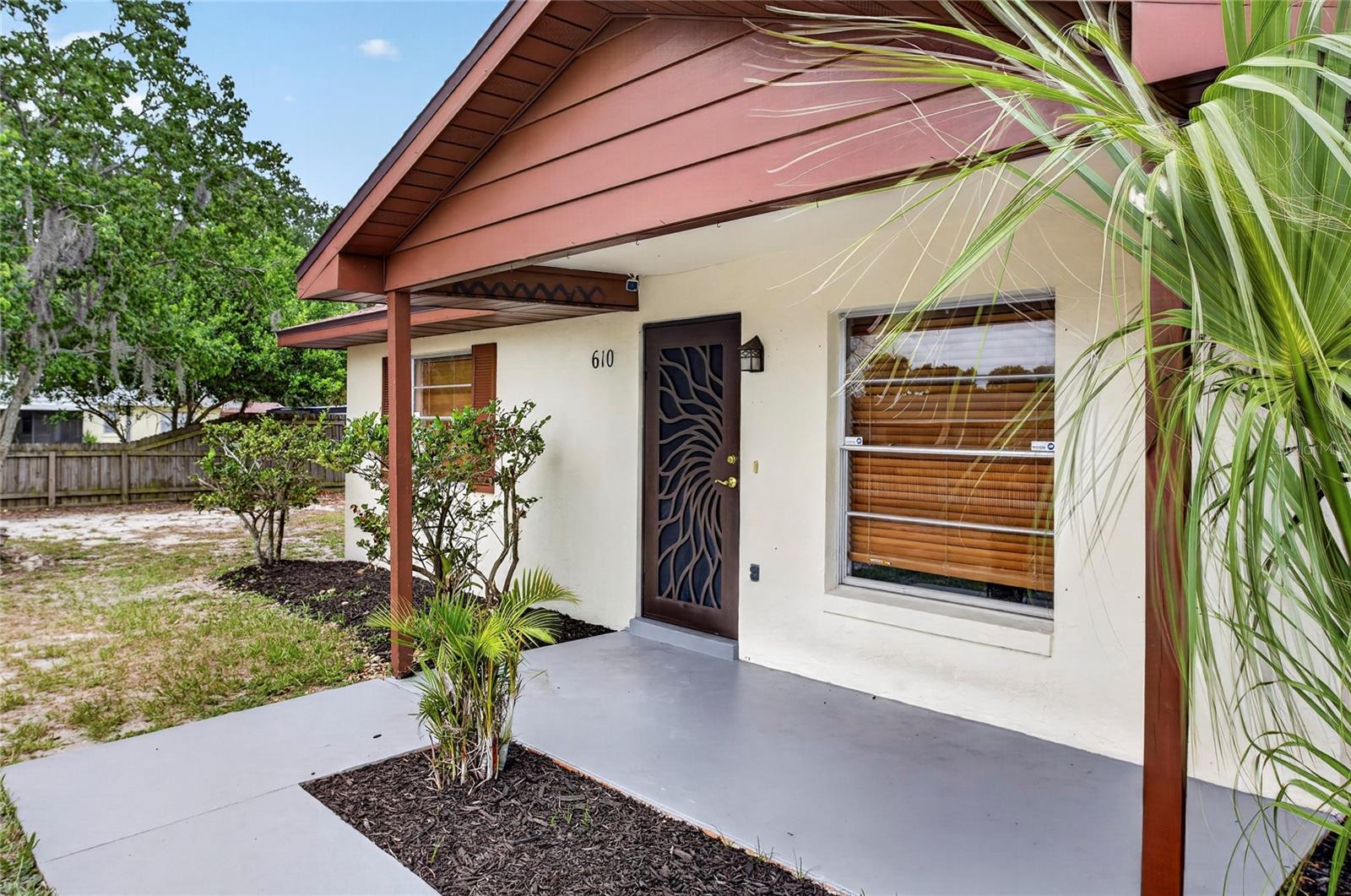 Beautifully updated 2-bedroom, 1-bath home conveniently located in the heart of Lake Wales. Situated just off Highway 60 and within walking distance of Publix, shopping, restaurants, pharmacies, and other everyday conveniences. Inside, you’ll find an open and inviting floor plan featuring updated flooring, neutral designer colors, abundant natural light, and a spacious living area perfect for entertaining. The kitchen offers attractive quartz countertops, ample cabinet space, and a functional layout that opens to the main living areas. The bathroom has been tastefully updated, making this home truly move-in ready. Outside, enjoy a covered front porch, mature landscaping, a large fenced backyard, and a detached garage/workshop providing excellent storage, hobby space, or room for projects. Conveniently located near downtown Lake Wales, medical facilities, schools, parks, and the famous Bok Tower Gardens. Whether you’re a first-time homebuyer, downsizing, or looking for a turnkey investment property, this home offers the perfect combination of comfort, style, and convenience.