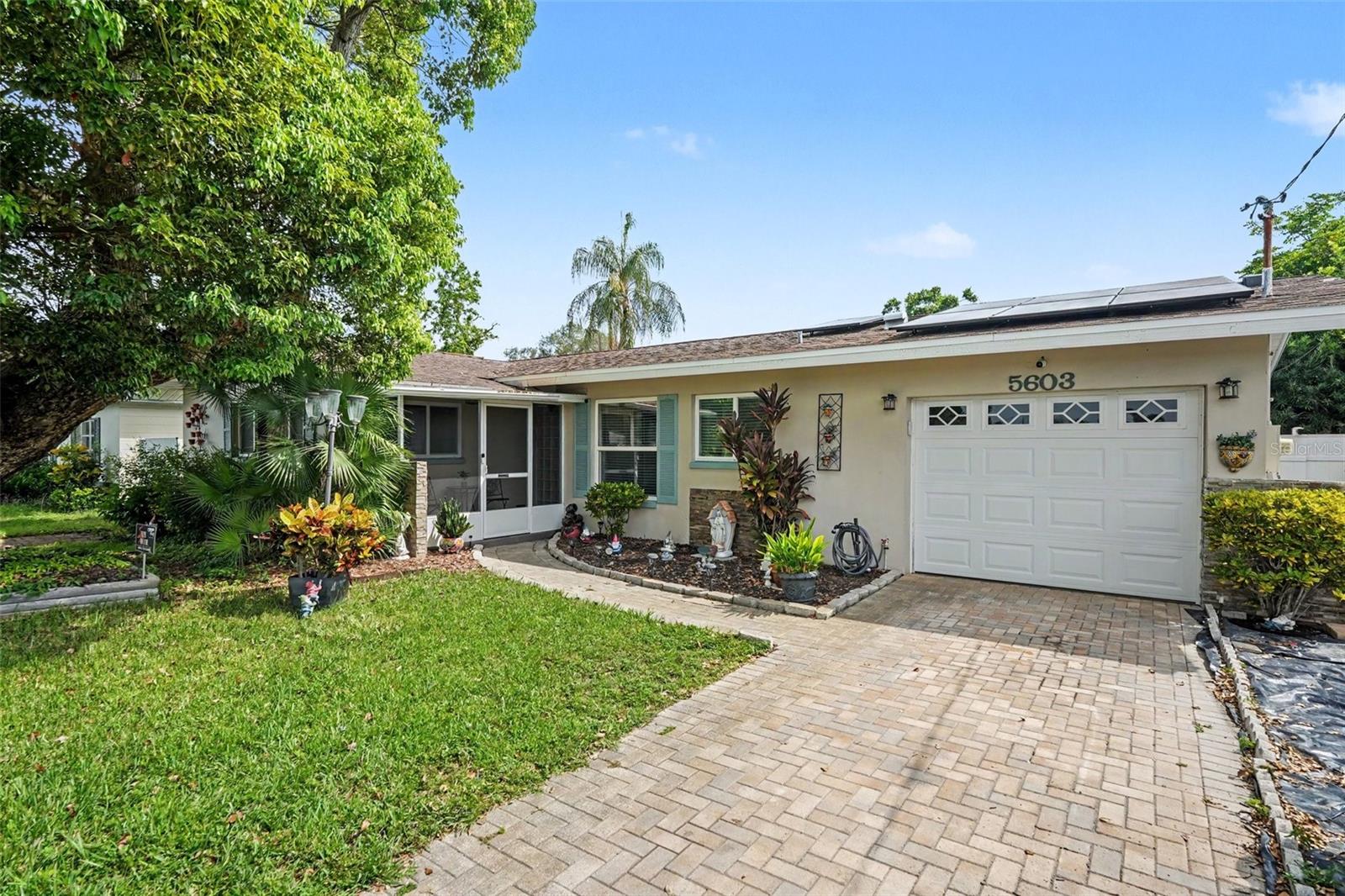 PRISTINE RETREAT WITH A SECLUDED BACKYARD! Experience true pride of ownership in this exceptionally well-maintained home, lovingly cared for by only its second owner. Enjoy your morning coffee on the cozy, screened-in front porch before stepping inside to a bright layout featuring premium stone countertops and a spacious primary suite with an oversized walk-in closet. The real highlight is the private backyard oasis, complete with a beautiful gazebo over the relaxing hot tub and a massive vinyl-fenced yard perfect for entertaining. Nestled in a quiet, established neighborhood just minutes away from the vibrant scene of Downtown St. Pete, world-class Gulf beaches, shopping, and major highways. Perfect as a turn-key primary residence or a premium investment property!