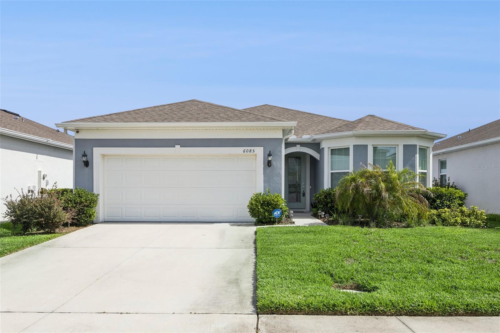 Why wait to build when this move in ready 4 bedroom, 3 bath home is ready now! Located in the desirable Amelia Groves community near Lake Nona in St. Cloud, this newer construction home offers peaceful pond views and a spacious open concept layout designed for everyday living and entertaining. The kitchen features stainless steel appliances, quartz countertops, bright white cabinetry, subway tile backsplash, a large center island, and a walk-in pantry, flowing seamlessly into the dining and living areas. The private primary suite includes a spacious walk-in closet, dual vanities with quartz countertops, and a walk-in shower. Three additional bedrooms and two full bathrooms provide flexibility for family, guests, or a home office. Step outside and enjoy the beautiful screened-in porch overlooking the pond, creating the perfect spot for morning coffee or relaxing evenings. Additional upgrades include a whole home water softener system, reverse osmosis system in the kitchen, rain gutters, washer, dryer, window blinds, designer glass front door, ceramic tile flooring in main living areas, and a 2-car garage. Residents enjoy amenities including a pool, cabana, playground, walking trails, 1G internet, and streaming TV all with no CDD fees. Conveniently located between Downtown St. Cloud and Lake Nona with easy access to shopping, dining, major highways, and top rated schools. Nearby outdoor attractions include Lakefront Park, Harmony Golf Preserve, and Lake Lizzie conservation areas. A great opportunity to own a newer construction home with thoughtful upgrades in one of Central Florida’s fastest-growing areas.