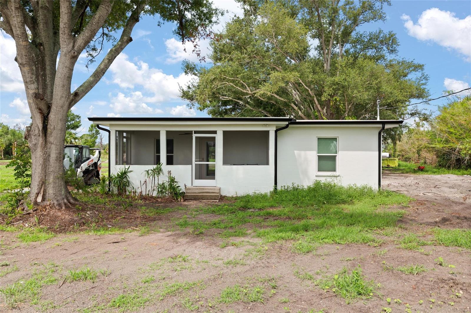 Rare opportunity to own a 4.90-acre parcel in Englewood, located a 1/4 mile to the south of the intersection of Winchester Blvd and Placida Rd. The site is 6 miles from the bridge to Boca Grande. Zoned Manufactured Home Conventional (MHC) with low-density residential land use allowing up to 5 units per acre. The site is prime for redevelopment and possibilities are endless for residential or commercial rezoning. This flexible zoning offers potential for up to 19 single-family or manufactured homes, subject to buyer verification with the county. The property includes a 2-bedroom, 1-bathroom single-family residence built in 1953, offering 1,000 square feet of heated living space, which also makes an excellent office space for potential commercial users. The site has been scraped and cleared making it ready for the next owner. Public water and sewer availability(currently on septic), plus electricity, cable, and internet connections, make this an appealing site for development or investment. Enjoy a prime location close to area beaches, golf courses, marinas, shopping, and dining in Englewood, Rotonda West, and Boca Grande. Buyers to verify all dimensions, zoning, and use restrictions with Charlotte County. The area is in a high growth corridor with national brand name commercial and residential developments. Tracts of land this size are becoming harder to find in Charlotte County. Survey and clean Phase 1 Environmental study available. Contact us today to schedule a showing and explore the possibilities this property has to offer.