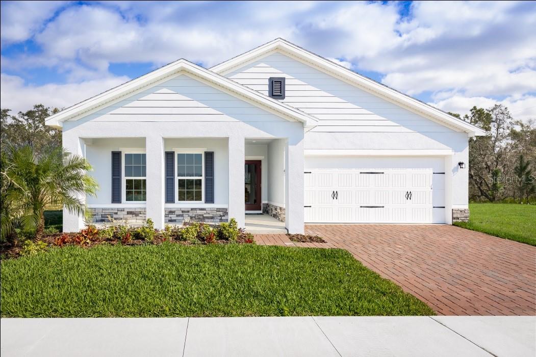 Pre-Construction. To be built. Beautiful new construction home ready for you to put your personal touch on. Selections include, cabinets color, exterior color scheme, flooring and lighting finishes. The Mahogany single-family home offers a fresh take on fine living. From your covered front porch or 2-car garage, step into a ranch floor plan that blends convenience and style. There’s plenty of room for family and friends in 2 spacious bedrooms, with a full bath just outside their doors. Gather in your great room for movie nights, and don’t forget to prep popcorn and other delicious snacks on your gourmet kitchen’s large island. Enjoy the night air on your lanai before heading to bed in the sensational owner’s suite, featuring a walk-in closet and step-in shower. Hillwood Preserve features single-family homes in a CDD-free community with low monthly HOA plus all appliances included. Community amenities include a fenced, off-leash dog park and a shaded playground for the kids. Bob Gardner Park is right around the corner, where you’ll find a swimmable lake for your furry friends, nature trails, picnic areas, and sports fields, perfect for some fun in the sun. Located off SR-64, just 10 minutes to I-75, for an easy commute around town, no matter where your travels take you. All Ryan Homes now include WIFI-enabled garage opener and Ecobee thermostat. **Closing cost assistance is available with use of Builder’s affiliated lender**. DISCLAIMER: Prices, financing, promotion, and offers subject to change without notice. Offer valid on new sales only. See Community Sales and Marketing Representative for details. Promotions cannot be combined with any other offer. All uploaded photos are stock photos of this floor plan. Actual home may differ from photos.