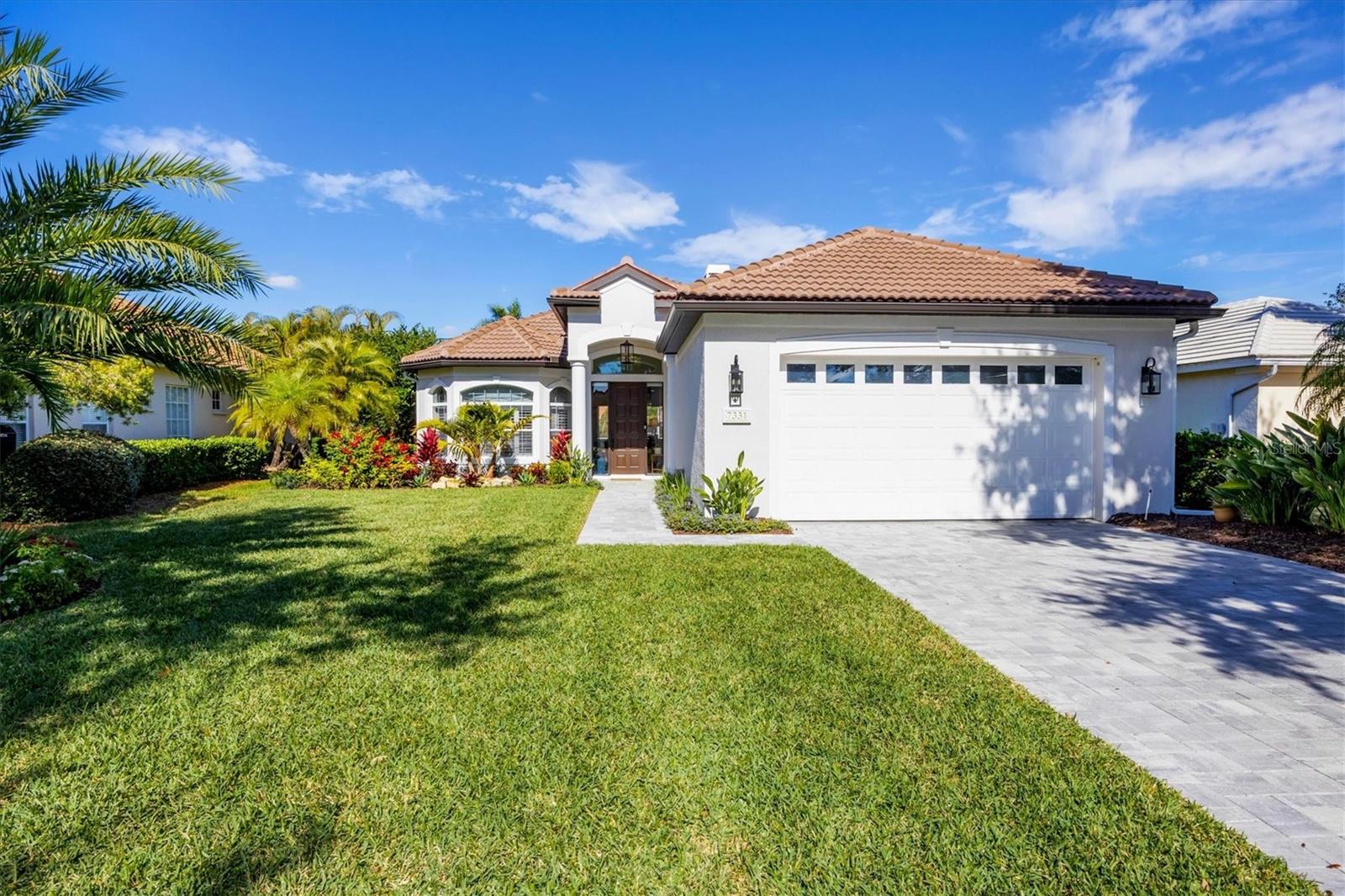 Welcome to an exceptional residence in the heart of University Park Country Club, where timeless elegance, resort-style amenities, and an enviable lifestyle converge. Perfectly positioned on the coveted Saint Georges Way, this beautifully appointed home offers refined Florida living within one of Sarasota’s most established gated communities.From the moment you arrive, the home’s inviting curb appeal and manicured landscaping set the tone for what awaits inside. Thoughtfully designed, the interior is bathed in natural light and features an open, flowing floor plan that effortlessly balances sophistication with comfort. Generous living and dining spaces provide the ideal backdrop for both everyday living and elegant entertaining, while large windows and sliding glass doors create a seamless connection to the outdoors.The kitchen serves as the heart of the home, offering ample cabinetry, expansive counter space, and a layout that encourages gathering—whether hosting intimate dinners or lively celebrations with family and friends. Adjacent living areas are warm and welcoming, designed to maximize both functionality and style. Well-proportioned bedrooms provide peaceful retreats, with the primary suite offering a serene escape complete with a spa-inspired bath and generous closet space. Step outside to your private outdoor oasis, where a screened lanai invites you to relax and unwind year-round. This tranquil space is perfect for morning coffee, alfresco dining, or simply enjoying Florida’s beautiful weather in complete privacy. Whether lounging poolside or entertaining guests, the outdoor living area enhances the home’s appeal and extends your living space into the sunshine. Living in University Park Country Club means embracing a truly elevated lifestyle. Residents enjoy access to 27 holes of championship golf, a state-of-the-art fitness center, tennis and pickleball courts, croquet, and an array of social clubs and activities. The elegant clubhouse offers fine and casual dining, creating a vibrant social hub for members and guests alike. Meticulously maintained grounds, mature landscaping, and a strong sense of community further define this sought-after enclave.Ideally located just minutes from UTC shopping and dining, downtown Sarasota, pristine Gulf beaches, and cultural attractions, this home offers the perfect blend of privacy, convenience, and luxury. 7131 Saint Georges Way is more than a residence—it is an opportunity to enjoy the best of country club living in one of Sarasota’s most desirable communities.