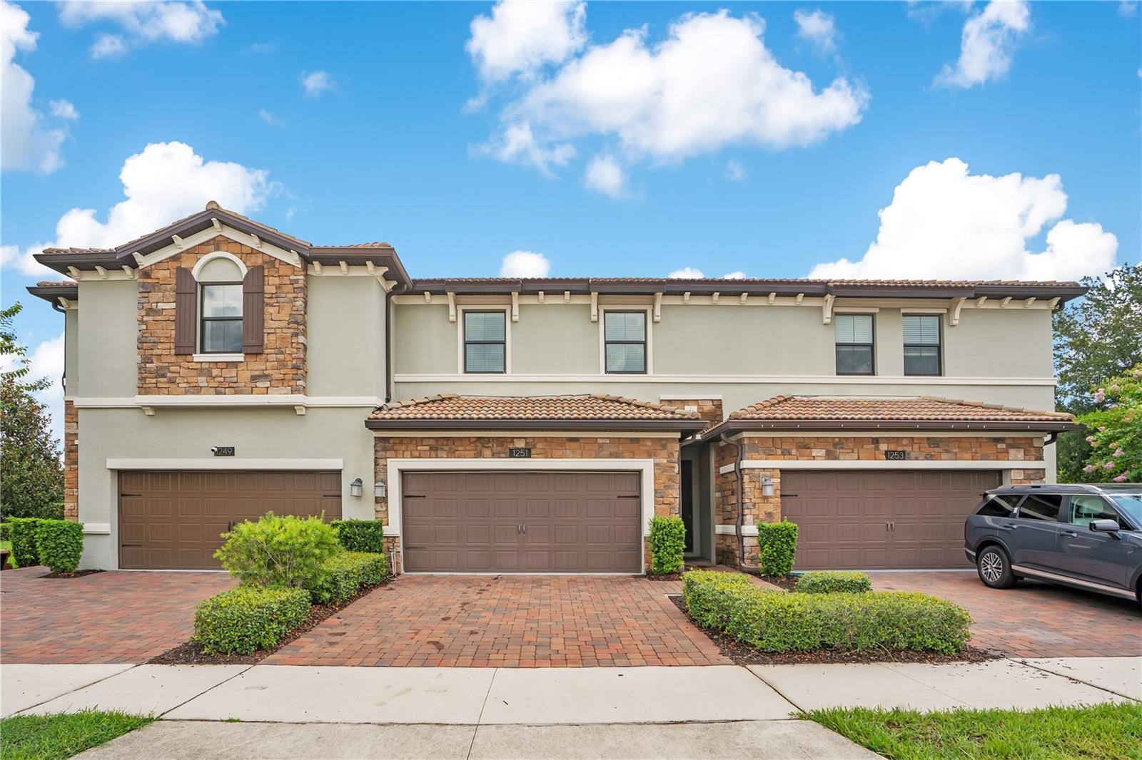 Experience the Ultimate Florida Lifestyle at The Vistas at ChampionsGate! Welcome to this beautifully appointed 3-bedroom, 2.5-bath Townhome, where luxury, comfort, and resort-style living come together in one of Central Florida's most sought-after gated communities. Step inside to discover a bright, open-concept floor plan enhanced by elegant wood-look tile flooring throughout the main living areas. Designed with both everyday living and entertaining in mind, the spacious layout flows effortlessly into a stunning gourmet kitchen featuring 42-inch wood cabinetry, gleaming quartz countertops, stainless steel appliances, and an abundance of prep and storage space ~ the perfect gathering place for family and friends. Upstairs, you'll find three generously sized bedrooms, including a relaxing primary suite. Enjoy the ease of low-maintenance living with an HOA that includes internet, cable TV, daily valet trash service, landscaping, irrigation, and more, giving you more time to enjoy everything this incredible community has to offer. Living at The Vistas at ChampionsGate means having access to an unmatched collection of world-class amenities. Residents enjoy exclusive access to the Vista Club, featuring a heated resort-style pool and spa, state-of-the-art fitness center, golf simulator, and game room. You'll also have full access to the spectacular 14,000-square-foot Oasis Club, complete with a lazy river, resort-style pool, private cabanas, tiki bar, full-service restaurant, movie theater, fitness center, arcade, and activities designed for year-round enjoyment. Perfectly positioned just minutes from Walt Disney World Resort, Omni Orlando Resort at ChampionsGate, championship golf courses, upscale shopping, exceptional dining, Orlando International Airport, major highways, and Central Florida's world-famous attractions, this location offers the perfect balance of convenience and recreation. Whether you're searching for a full-time residence or a low-maintenance Florida retreat, this exceptional townhome offers the lifestyle you've been dreaming of. Don't miss this opportunity to make this beautiful ChampionsGate home yours. Schedule your private showing today and discover everything The Vistas at ChampionsGate has to offer.