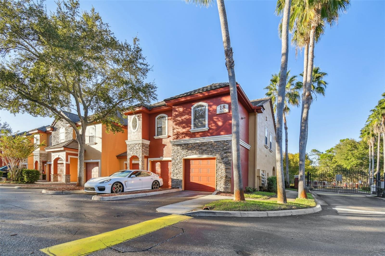 If you want to live like you vacation, come immerse yourself in the lifestyle that Tuscany at Innisbrook offers! It is truly an exquisite experience! Located in a gated community in beautiful Palm Harbor, FL, this highly sought-after 2 bedroom, 2.5 bath, 1 car garage end unit boasts a plethora of features, upgrades and amenities that you only find in resort-style living. 
As you enter through the main/front door, the 1st floor includes the living room, dining room, kitchen and half bath. The half bath is located near the kitchen and has new lighting, faucets and hardware. The end unit combined with the high ceilings fill this home with warm natural light. Crown molding adds a refined touch. Enjoy the serene water view of the fountain and pond from your screened in lanai just off the living room through the sliding glass doors. 
The one car garage is oversized with high ceilings to capture even more storage opportunities. Washer and Dryer is located in a closet in the garage. You can pull right into the garage and walk directly into your unit. Very convenient when unloading groceries or dodging the rain!  
Upstairs you will find the master bedroom and bathroom with 2 spacious walk-in closets. The bathroom has a large soaking tub/shower combo and a brand new (2023) vanity, light fixture, sink and faucet. The guest bedroom feels like it is another master bedroom. It has 1 large walk-in closet and its own bathroom which includes a large soaking bathtub/shower and brand new (2023) granite counter, sink, light fixture and faucet. 
The layout for the entire unit flows exceptionally well for function, purpose and privacy. The townhome concept gives a sense of seclusion and with no neighbors above/below/behind or to one side, it truly feels like a retreat. Other updates to the unit include: (2023) new carpet upstairs (including stairs), LVP flooring downstairs, and garbage disposal. (2022) Hot water heater. (2019) HVAC which has been professionally serviced every six months after installation. 
Directly across the street and just steps away from the unit is a spectacular resort style heated pool (with waterfall), hot tub, fitness center and a recreation center with air hockey, pool table and ping pong. Sit by the pool in lounge chairs and soak up the sun or curl up with a book under the umbrellas. Or you can sit at tables and chairs in a screened lanai right off the pool. Additionally, you can host private gatherings in the clubhouse with a fully updated kitchen. 
And yet there is more. There is a library and a movie theater room with large comfy leather chairs. Still not done yet! The community boasts tennis courts, basketball courts, a playground, bike racks and a car wash! 
We would be remiss to not mention Innisbrook Golf Community nearby. There are social and golf memberships available. Tuscany at Innisbrook is very close to Wall Springs Park, Pinellas Trail, Lake Tarpon, Tarpon Springs (Sponge Docks), Fred Howard Park, Honeymoon Island and Crystal Beach. A myriad of restaurants and shopping are all close by. Hospitals, TIA and PIE airports are all within close proximity as well. Did we mention that Tuscany at Innisbrook is located in a non-flood zone? Make this resort your home!