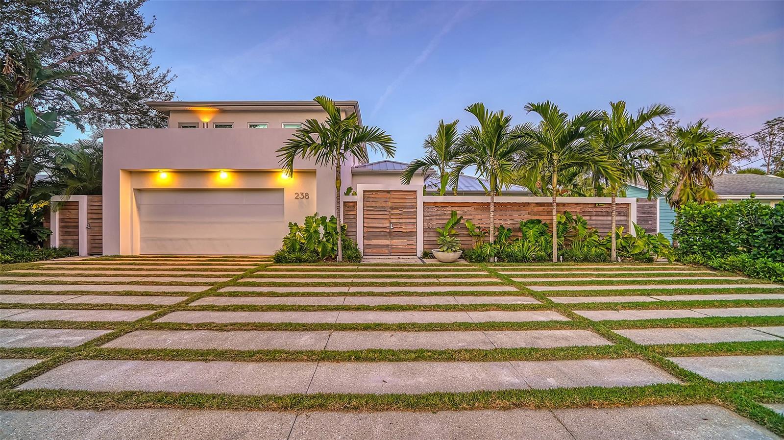 Stunning Canal front renovation located on Palm Island (a short walk to the Beach-Access 10) with all the best Siesta Key has to offer. This 4 Bedroom, 4 Bathroom home stuns as soon as you enter the property and the threshold with a custom mahogany double entry door under a Ipe wood inlaid ceiling. Hurricane rated Impact Glass throughout. The interior renovated by Nautilus Homes (AIA Florida 2022 Builder of the Year), boasts Porcelain Provenza W-Age Italian tile featuring a unique cross-cut wood pattern on the main floor & Legno Bastone European White Oak Wood 8” wide plank flooring on the upper floor. The kitchen features Custom Brookhaven cabinetry and Silestone countertops, a Dornbracht faucet & Hand painted limited edition tiles by Ann Sacks as a backsplash. Viking Professional, Sub-Zero/Wolf and ASKO high-end appliances, including Wolf induction cooktop and Zephyr curved-canopy range hood for the chef. The Master Bathroom features Custom mosaic tile wall, Wetstyle freestanding bathtub & Elite Woodwork Custom Cabinetry. All Bathrooms feature Hansgrohe fixtures, Toto toilets & Vanities & mirrors by Decotec & Wetstyle. The backyard is very private with no homes visible across the wide canal. Decks & Terraces with Cable railings with Ipe wood handrails, rear decks with cypress wood inlaid ceilings and marine-grade stainless steel fans overlooks a Tropical Paradise designed by DWY Landscape Architects, whose awards include ASLA Florida Award of Excellence, and the newer (2018, including Seawall Cap) composite dock with 10k lift on the Grand Canal. A Custom Six Kayak storage rack & a Kayak lift round out the Island lifestyle. There is even a custom treehouse for children built by Miami Treehouse Builders. This home is ideally situated on Palm Island, which is a Island on a Island. You are a short walk to the Beach (Beach Access 10) & the restaurants and nightlife of the Village, without the traffic.