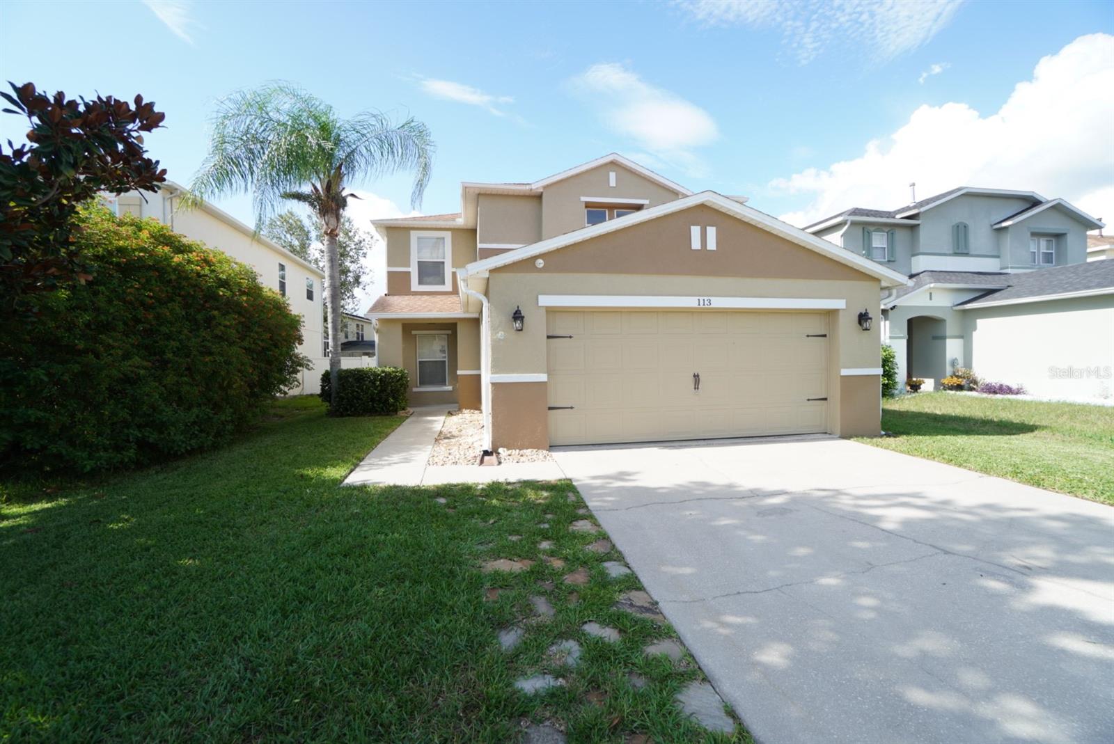 Opportunity awaits in this spacious and versatile Davenport home offering more than 2,200 square feet of living space, a two-car garage, and a flexible floor plan ideal for a primary residence, vacation home, or income-producing short-term rental. Conveniently located just minutes from Central Florida's world-famous theme parks, shopping, dining, and major roadways, this property combines location, comfort, and investment potential. Being zoned for short term rental makes it easy to add to your rental portfolio. Live in or rent it or enjoy the space. Step inside to discover a welcoming bonus room at the front of the home, perfect for a game room, home office, media room, playroom, or additional gathering space. The bright and open living area flows seamlessly into the dining room and kitchen, creating an ideal layout for entertaining while allowing privacy and quiet in the upstairs living quarters. The kitchen is designed for both functionality and style, featuring granite countertops, upgraded appliances, a gas stove, ample cabinetry, and a spacious pantry for additional storage. The open-concept design allows the chef to remain part of the conversation while preparing meals and entertaining guests.
The home has been thoughtfully updated with a newer roof, newer AC system, gas tankless water heater, irrigation system, and garage door opener, helping to reduce future maintenance concerns and improve everyday convenience.
Downstairs, durable tile flooring provides a clean and attractive living space, while the upstairs features laminate flooring throughout for easy maintenance and a modern look. The bedroom layout offers comfortable private retreats for family members and guests alike. A versatile bonus room with a closet and door provides the flexibility to serve as a fourth bedroom, home office, computer room, hobby space, or guest suite. Step outside to enjoy the fully fenced backyard and relaxing rear porch enhanced with attractive paver flooring. Whether hosting a barbecue, enjoying your morning coffee, or creating a play area for children and pets, this outdoor space offers both comfort and functionality. The two-car garage provides convenient covered parking and additional storage space for tools, bicycles, recreational equipment, and household items. Whether you're searching for a full-time residence, seasonal Florida retreat, or short-term rental investment, this property offers the perfect blend of space, versatility, updates, and location. With many of the major improvements already completed, there's little left to do except add your personal touch and start enjoying everything Central Florida has to offer.