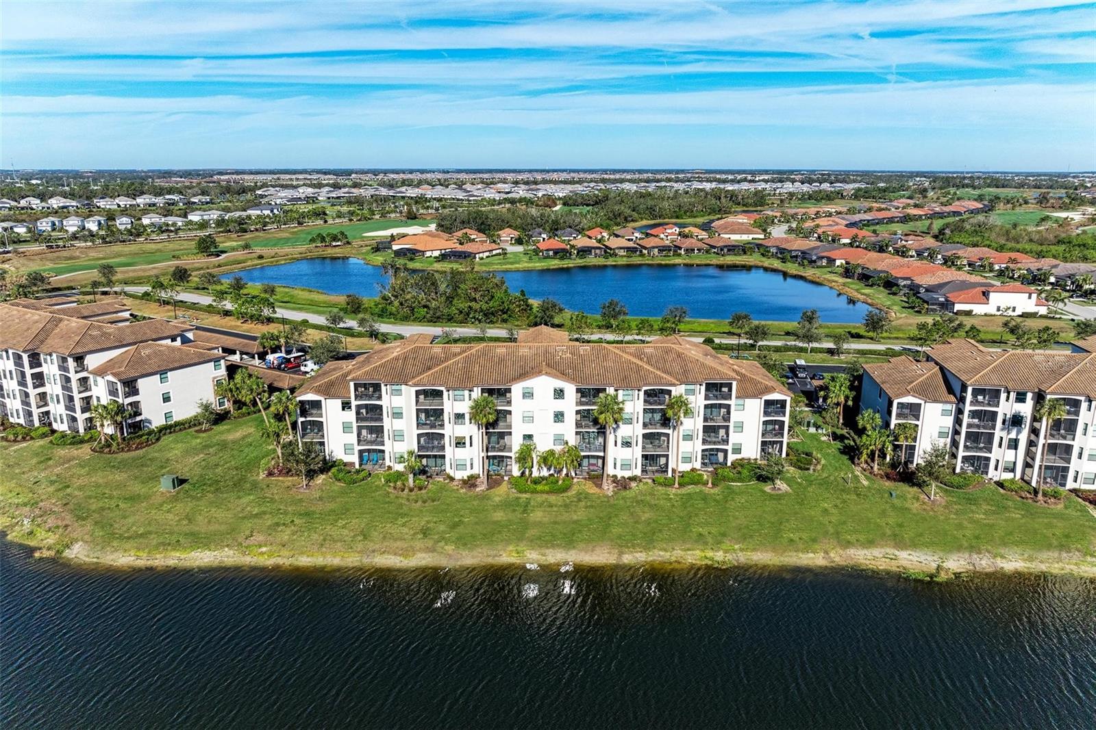 Welcome to Lakewood National Golf Club, where luxury living meets championship golf course views. This beautifully appointed condo offers a turnkey opportunity with the option for repeat rental income or can be delivered vacant for personal use.

Featuring two bedrooms and two bathrooms, this residence is thoughtfully designed for both comfort and functionality. The spacious family room is filled with natural light and showcases breathtaking views of a large, tranquil lake.

The kitchen is well-equipped with custom granite countertops, large island with no step up, a cozy breakfast nook, and ample cabinetry—perfect for both everyday living and entertaining. A separate formal dining area provides an elegant space for hosting family and friends.

The primary suite is bright and generously sized, featuring a walk-in closet along with an additional closet for extra storage. The ensuite bathroom includes a walk-in shower. The guest bedroom and bath are ideally positioned across the hall, offering privacy and convenience for visitors.

Step onto the rear lanai to relax and unwind while enjoying serene lake and golf course views—the perfect setting to end your day.

Residents enjoy an exceptional array of resort-style amenities, including a grand clubhouse, 24-hour guard-gated security, a state-of-the-art fitness center with classes, a resort-style pool with poolside dining, eight lighted Har-Tru tennis courts, pickleball, bocce, and a full-service spa.

Ideally located near world-renowned Gulf beaches, fine dining, and premier shopping, this home offers the very best of Florida’s luxury golf community lifestyle.