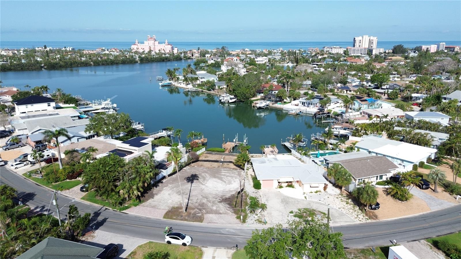 Build Your Coastal Dream Home with Don CeSar Views – Prime Waterfront Lot in Belle Vista, St. Pete Beach Welcome to 3738 Belle Vista Drive, a rare and remarkable opportunity to own one of the finest waterfront lots in all of St. Pete Beach. Perfectly positioned in the coveted Belle Vista community, this cleared lot features a newer seawall, protected deep water, and panoramic western views—including iconic vistas of the historic Don CeSar Hotel. Enjoy breathtaking sunsets and direct boating access to the Gulf of Mexico with no fixed bridges—ideal for yacht owners and boating enthusiasts alike. The seawall and dock are intact and feature a lift, perfect for boaters looking for easy access to the open waters of Shell Key, Fort De Soto Park, Egmont Key State Park, and Anna Maria Island. Launch your boat from your backyard and cruise to nearby waterfront restaurants or enjoy a day on the open water. Design and build your custom beachside retreat on this generously sized lot, nestled among upscale homes and just a short stroll to the wide, sugar-sand shores of St. Pete Beach—consistently ranked among the best beaches in the U.S. Belle Vista is a serene yet connected community offering: • Quick access to downtown St. Pete for world-class dining, arts, and events • A convenient 30-minute drive to Tampa International Airport • Walkability to local beach bars, restaurants, shops, and Publix • Proximity to pass-a-grille, Shell Key Preserve, and Fort De Soto Park Whether you're envisioning a sleek modern masterpiece or a charming coastal estate, this exceptional lot is your canvas for the ultimate Florida lifestyle. Don’t miss this chance to create your sanctuary in one of the most desirable and vibrant waterfront neighborhoods in Tampa Bay. Live the dream. Build the vision. Own the lifestyle.