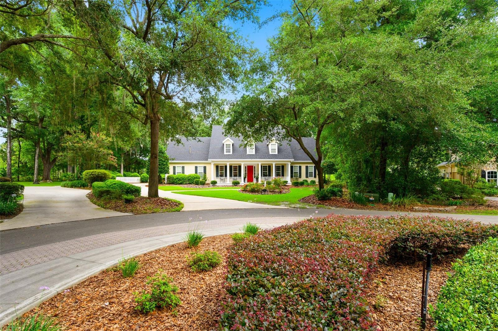 You will fall in love with this 4-bedroom, 3.5 bath home with an office and 2 bonus rooms, built by renowned builder Tom Spain and located in the desirable Haile Plantation community.  As you drive through The Colony at Kestrel Point you will be welcomed by a beautiful canopy of mature trees leading you to the picturesque, tree-lined setting of this stunning golf course home.  The classic front porch and colonnade along with the soothing sounds of the pool fountains create an unforgettable first impression. Inside, gorgeous heart pine floors flow throughout the home, adding warmth, charm and timeless elegance! Designed for both everyday living and entertaining, the spacious floor plan features a large family room that opens to the kitchen and screened porch. The oversized windows bring in lots of natural light showcasing beautiful views of the private lot and golf course! The kitchen is the heart of the home, featuring granite countertops, stainless steel appliances, a center island, a Butler's pantry and a walk-in storage pantry. All of the bedrooms are generously sized and offer abundant storage. The luxurious primary suite has been completely updated and features his-and-her vanities and an oversized walk-in shower. Just around the corner, the dedicated office or piano room offers 3 large windows and plenty of space for work, study, or creativity! Upstairs, you will find an en suite bedroom, an additional bedroom and huge flex space that share a hall bath. Step through the French doors at the rear of the home to unwind on the lovely paver patio, where you can enjoy the sounds of nature and peaceful surroundings. This home is conveniently located just 8 miles from the University of Florida, with shopping, dining and entertainment along the way. This is a rare opportunity to enjoy golf course living, privacy, and convenience all in one exceptional home! The Haile Plantation community offers miles of walking trails, parks, playgrounds, basketball, a Village Center with shops and restaurants and the Hawkstone Country Club. The Hawkstone Country Club (membership required) offers dining, golf, tennis, pickleball, a gym and two pools.