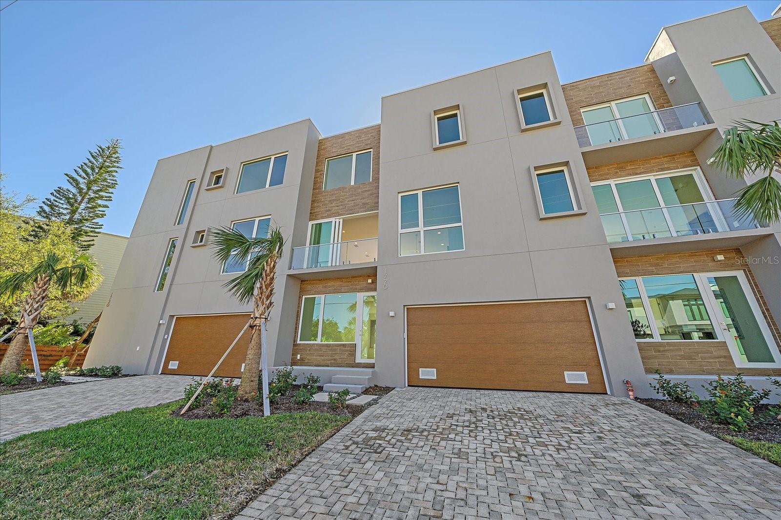One or more photo(s) has been virtually staged. Discover Laurel on the Water — a rare waterfront enclave of seven canal-front townhomes at 1720 Alderman St, Sarasota. Priced at $1,745,000, this newly constructed three-story residence with elevator blends striking contemporary design with effortless coastal living just blocks from downtown.

Thoughtfully oriented to maximize light and water views, the home showcases expansive impact glazing, multiple balconies, and a dramatic waterfall-edge kitchen island with premium appliances and custom cabinetry. A versatile first-floor great room with a private entrance functions perfectly as an office, guest suite, or media space. The open plan flows seamlessly to outdoor living and water-facing vistas—ideal for entertaining or quiet relaxation.

A private slip is available; the property sits off Hudson Bayou with direct access leading to Sarasota Bay for easy waterfront recreation (kayak, paddleboarding). Laurel on the Water delivers maintenance-free living with a resort-style pool, lush landscaping, and a spacious two-car garage for secure parking and storage.

Live moments from Sarasota’s cultural core: the Ringling Museum, theaters, ballet and opera, and an exceptional dining scene featuring numerous Zagat-rated restaurants. Marina Jack, world-class beaches, including Siesta Key, are just minutes away, and multiple golf courses are within a short drive.

1720 Alderman St is more than a home—it's a refined waterfront lifestyle in one of Sarasota’s most coveted neighborhoods. Schedule your private showing today.