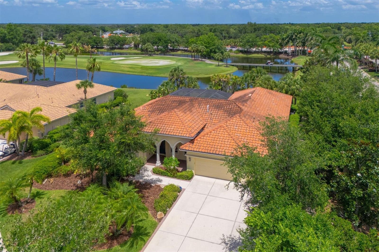 One or more photo(s) has been virtually staged. Original owner and very private Bonus Room Hemingway-model with views of a great bass fishing pond and the 3rd hole at Waterlefe Golf & River Club, the areas Only golf & boating community. This adaptable floor plan is waiting for your personal touches and features a versatile bonus room, perfect for a second home office, media lounge, or create your own private guest wing. The indoor living area opens in multiple places to 2 separate covered lanai's - one at the rear of the home that is pre-plumbed for a custom outdoor kitchen—ready and extended welcoming large gatherings and weekend dinners. Enjoy a quiet retreat with no rear neighbors in the area's only neighborhood pairing championship golf with a direct-access river marina. Waterlefe amenities feature option membership to an 18-hole semi-private golf course (8-time U.S. Open Qualifier site), an optional 59-slip marina on the Manatee River with Gulf access, and The River Club at Waterlefe (included in your HOA fees) the true hub of community activities, featuring casual and fine dining, a 24-hour fitness center, and a saltwater Junior Olympic pool. Comprehensive Cable TV and WIFI included in the HOA fees - CDD fees included in total taxes.