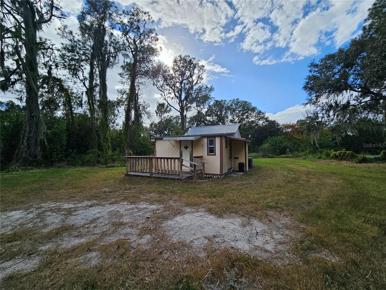 Country Living on almost 2 ACRES! Why rent an apartment when you can rent a house with LAND instead?! If you love nature and need room to park your trucks, trailers, or boats, this is the perfect home for you! This 1 BEDROOM, 1 BATHROOM HOUSE is situated on a HUGE lot and it's available for rent immediately! This adorable home features wood pattern vinyl flooring throughout, a spacious bedroom, and includes wall unit A/C. The kitchen has just what you'll need and includes a refrigerator and a flat-top stove. There's also a covered back patio, perfect for enjoying the outdoors. Call today to schedule a showing before it's gone!