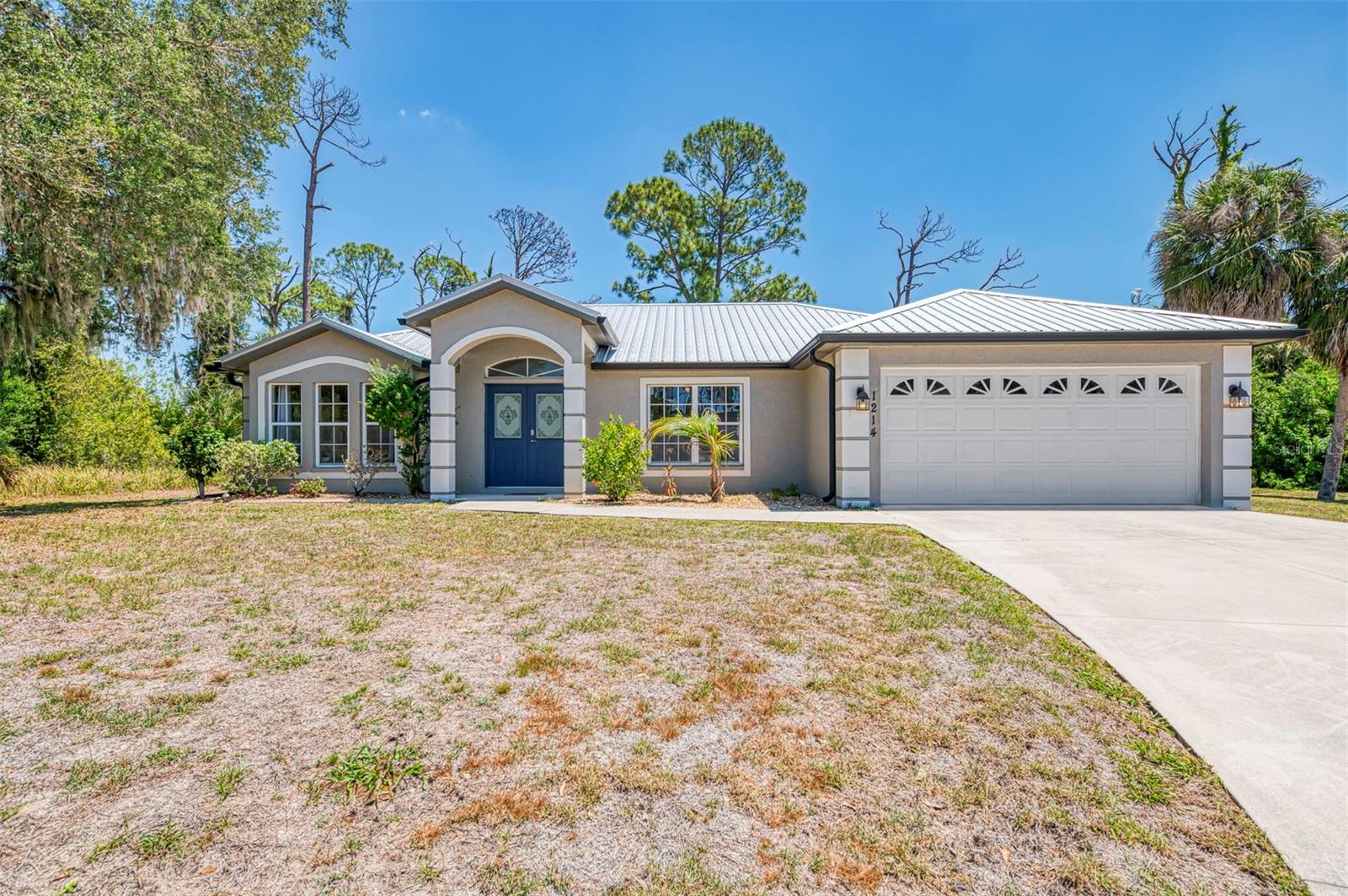 POOL HOME + HALF-ACRE CUL-DE-SAC LOT + EXTRA BUILDABLE LOT AVAILABLE! Rare opportunity to own this beautifully maintained IN-GROUND HEATED POOL HOME tucked away at the end of a quiet cul-de-sac on an oversized HALF-ACRE pie-shaped homesite — with the OPTION to purchase the oversized adjoining lot next door separately for added privacy, future building potential, RV/boat space, or long-term investment value! Opportunities like this are becoming harder to find in this fast-growing area. This 3-BEDROOM, 2-BATH, 2-CAR GARAGE home offers the perfect combination of space, privacy, and flexibility, making it ideal as a full-time residence, seasonal retreat, or income-producing Airbnb opportunity. Furniture is negotiable, making this an easy move-in or turnkey investment option! From the moment you arrive, you’ll notice the exceptional curb appeal with lush tropical landscaping, flowering shrubs, decorative rock, and concrete curbing surrounding the property. Well Pump Newer!  Relax and entertain in your sparkling screened in-ground pool area, plus enjoy an additional screened sunbathing space off the lanai for soaking up the Florida sunshine in privacy. Inside, the split-bedroom floor plan features soaring cathedral ceilings, beautiful plank tile flooring throughout, modern lighting, and an impressive double-door front entry. The spacious great room flows into the formal dining area with sliding glass doors opening directly to the pool patio, creating the perfect indoor-outdoor Florida lifestyle. The kitchen offers light wood cabinetry, stainless appliances, stainless sink and faucet, a pass-through window to the lanai, oversized pantry, breakfast bar, and generous prep space. Even better — NEW QUARTZ COUNTERTOPS will be installed in the kitchen and guest bath prior to closing! All appliances are included, plus newer washer & dryer (2024). The spacious primary suite features private sliding doors to the pool, oversized walk-in closet, and a tiled walk-in shower. Guest bedrooms are generously sized with ceiling fans, ample closets, and tile flooring throughout. The guest bath also serves as a convenient pool bath. Additional highlights include a newer STEEL METAL ROOF (only 4 years old) with gutters all around, desirable split floor plan, and prime location just off Toledo Blade Blvd. with quick access to I-75 and US-41. Shopping, dining, schools, and the new SMH hospital are all nearby, while Gulf beaches are only about 20 minutes away!  Whether you’re searching for a spacious pool home, investment property, Airbnb opportunity, or a property with future expansion potential thanks to the adjoining lot availability — this one checks all the boxes. Call today for your private showing before this unique opportunity is gone!