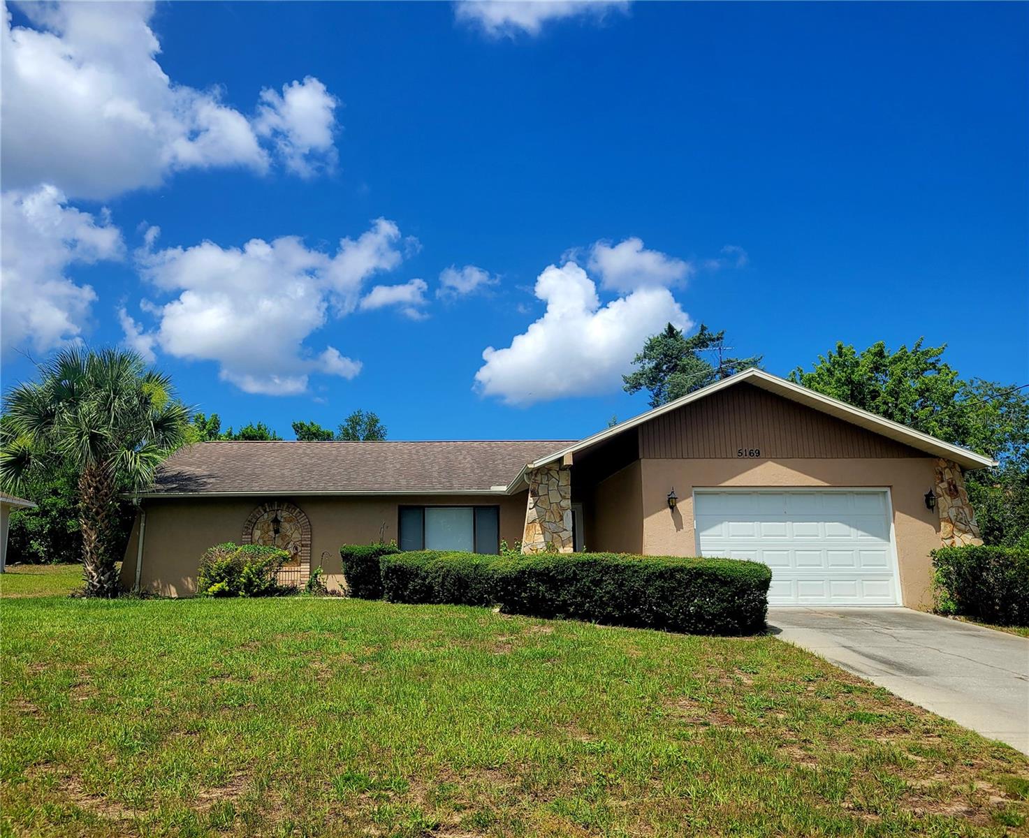 Welcome Home to your 2 Bedroom 2 Bath split floor plan single family home! Sitting on almost 1 quarter of an acre with an oversized 1 car garage with garage door opener and keypad. Home is 1338 sq ft of living and over 2000 sq ft total under roof.  Kitchen features all appliances with 2 pantries and a solid stone breakfast bar and countertops. Family Room features a Wood Burning Stone Fireplace for those chilly winter evenings. A spacious enclosed Lanai with windows and screens great for entertaining or relaxing. Close to shopping, restaurants, pharmacy and hospitals. Approximately 75 miles to Disney and Universal and 90 minutes to the Famous Clearwater Beach. Kayak the spring fed Weeki Wachee River and see the Mermaids swim. Contact us today for your private showing.