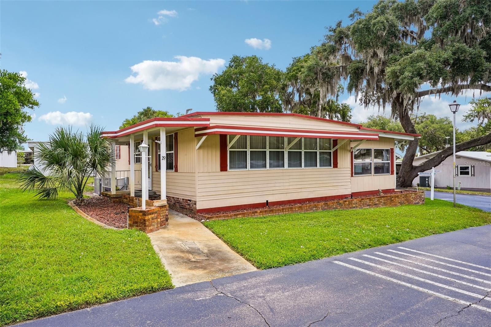 Enjoy beautiful views of Lake Griffin and the relaxed waterfront lifestyle Harbor Oaks is known for. This resident-owned 55+ community offers access to the Harris Chain of Lakes, along with a marina, fishing pier, clubhouse, pool, and an active social atmosphere.

This well-maintained 2-bedroom, 2-bath home offers 1,428 square feet of living space, making it one of the larger homes in the community. An interior laundry room adds convenience, while the expanded family room provides additional space for entertaining, hobbies, or simply relaxing and enjoying the lake views.

Updated subfloors throughout and a newer HVAC system installed in 2023 provide peace of mind, while the home's comfortable layout offers the opportunity to move right in and make it your own over time.

Conveniently located near shopping, dining, medical facilities, and The Villages, this is your opportunity to enjoy lake-view living in one of the area's most welcoming waterfront communities.