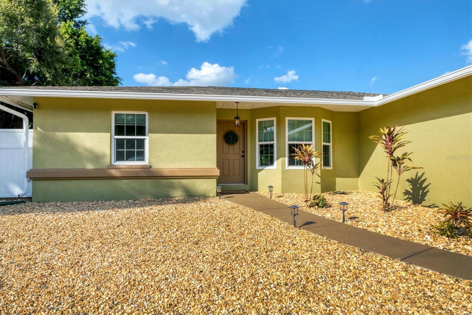 Fully Furnished Sarasota Home with Short-Term Rental Potential – Just Minutes from Beaches, Shopping & Nightlife! Whether you're looking for a primary residence, seasonal getaway, or income-producing investment property, this move-in-ready Sarasota home checks all the boxes. Offered completely furnished, this property is located within the City of Sarasota, allowing 7-day minimum rentals, creating an excellent opportunity for short-term rental income. This meticulously maintained 3-bedroom, 2-bath, 2-car garage home features a desirable split-bedroom floor plan and a spacious open-concept great room designed for comfortable everyday living and entertaining. The kitchen area is complemented by a generous 5x7 storage closet and convenient indoor laundry space, offering both functionality and flexibility. Step outside to the large, screened lanai, the perfect place to relax, dine outdoors, or enjoy Florida's year-round sunshine without the pests. An air-conditioned workshop/storage shed provides valuable additional space for hobbies, projects, or extra storage. Recent updates and notable features include new plank flooring in the bedrooms (2025), fresh interior paint (2025), new blackout blinds, hurricane-rated windows and doors, AC serviced in 2025, hot water heater (2019), and a roof replaced in 2014. The home also offers an expanded driveway, attractive low-maintenance landscaping, and added peace of mind with an exterior generator hookup and a Gemma's GM I 2000ED dual-fuel generator (gas/propane) that conveys with the property. Ideally located near Sarasota's world-famous beaches, shopping, dining, entertainment, and nightlife, as well as Ringling College of Art and Design and New College of Florida, this property offers the perfect combination of convenience, lifestyle, and investment potential. Don't miss this rare opportunity to own a fully furnished Sarasota home with flexible rental possibilities in a prime location!