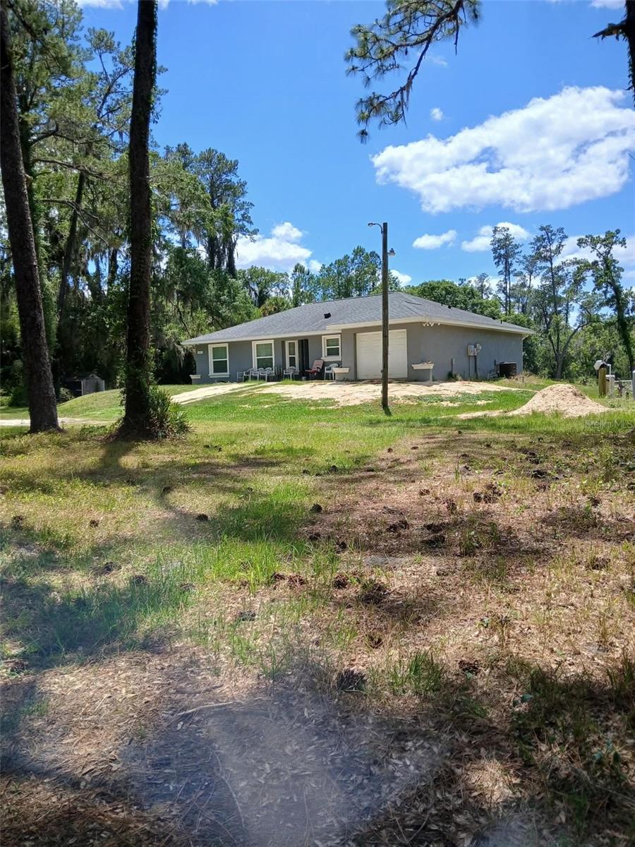 Discover the perfect blend of privacy, nature, and rural charm with this beautiful 14-acre property located in Citra. Zoned A-1, this versatile land offers endless possibilities—whether you're looking to start a mini farm, bring your animals, or simply enjoy wide-open space.
The property is rich with natural Florida wildlife, making it ideal for outdoor enthusiasts and those who appreciate peaceful surroundings. If you enjoy hunting, this land provides a great opportunity right in your own backyard. The home features 3 bedrooms and 2 bathrooms, thoughtfully positioned to overlook the scenic acreage, offering tranquil views and a true connection to the land.  Behind the home, you'll find a spacious pole barn—perfect for equipment, storage, or agricultural use—as well as a large workshop that’s already in place and just needs a few finishing touches to make it your own.  Whether you're seeking a private retreat, a working property, or a place to build your vision, this unique Citra acreage has the potential to make it happen.