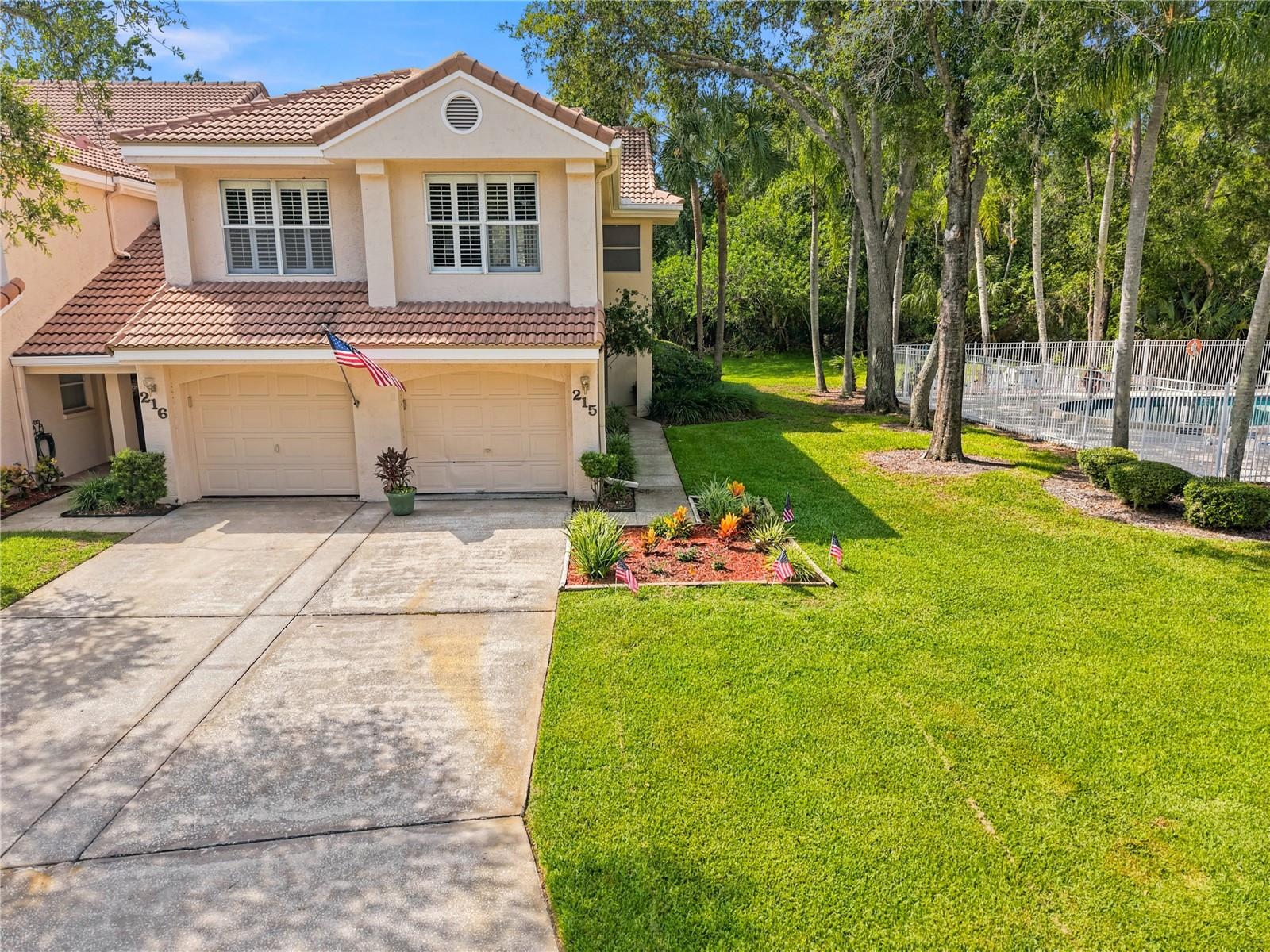 Maintenance free condo living in the sought after community of “Heatherwood” within the gates of prestigious East Lake Woodlands! This lovely first floor, fully remodeled end unit offers you over 1,200 sq ft of fine Florida living. Boasting 2 bedrooms, 2 bathrooms and 1 car garage, this modern open concept floor plan is ideal for family gatherings and entertaining. Lavish comfort from floor to ceiling as you enter to luxury vinyl flooring and soaring ceilings in the spacious great room with an abundance of natural light in your living and dining areas. Gorgeous, remodeled kitchen overlooks the great room with a convenient breakfast bar, white soft close cabinetry including cabinet pantry, granite countertop, dual undermount stainless steel sink and SS appliances including a ceran top range (2025), built-in microwave, dishwasher (2025) and 3 door refrigerator (2025).  Extend your living and entertaining outdoors through the sliding glass doors to the screened lanai area with generous outdoor seating space for family enjoyment. The luxury vinyl flooring continues throughout the ideal split bedroom layout. Privacy prevails! The primary bedroom is located off of the great room and offers an elegant double door entry. The ensuite features white, soft close cabinetry, dual vanities with granite countertops, undermount sinks, linen and wall closets, a full walk-in shower with designer tile accents, ledge seat and glass door. The secondary bedroom is located on the opposite side of the home and features a wall closet & ceiling fan. The updated hall bathroom is designed with a single vanity, granite counter with undermount sink, and a tub/shower combination. A perfectly situated hallway laundry closet leads to the garage.  Additional features include AC 2020, WH 2024. The HOA includes exterior maintenance and grounds, community pool, water, sewer, trash, cable, internet and exterior insurance. This premium homesite is just steps away from the community pool!  The home is zoned for exceptional schools and near to all, restaurants, shopping, medical and of course the famed Gulf beaches are nearby. The recently renovated Ardea Country Club lies within the gates of East Lake Woodlands. The club offers several levels of membership and has an impressive array of amenities including 2 championship golf courses, 2 resort style heated pools, 12 pickleball courts, 14 clay tennis courts, state-of-the-art fitness center, restaurant and bar. Magnificent home in a prime, convenient location… carefree Florida living!