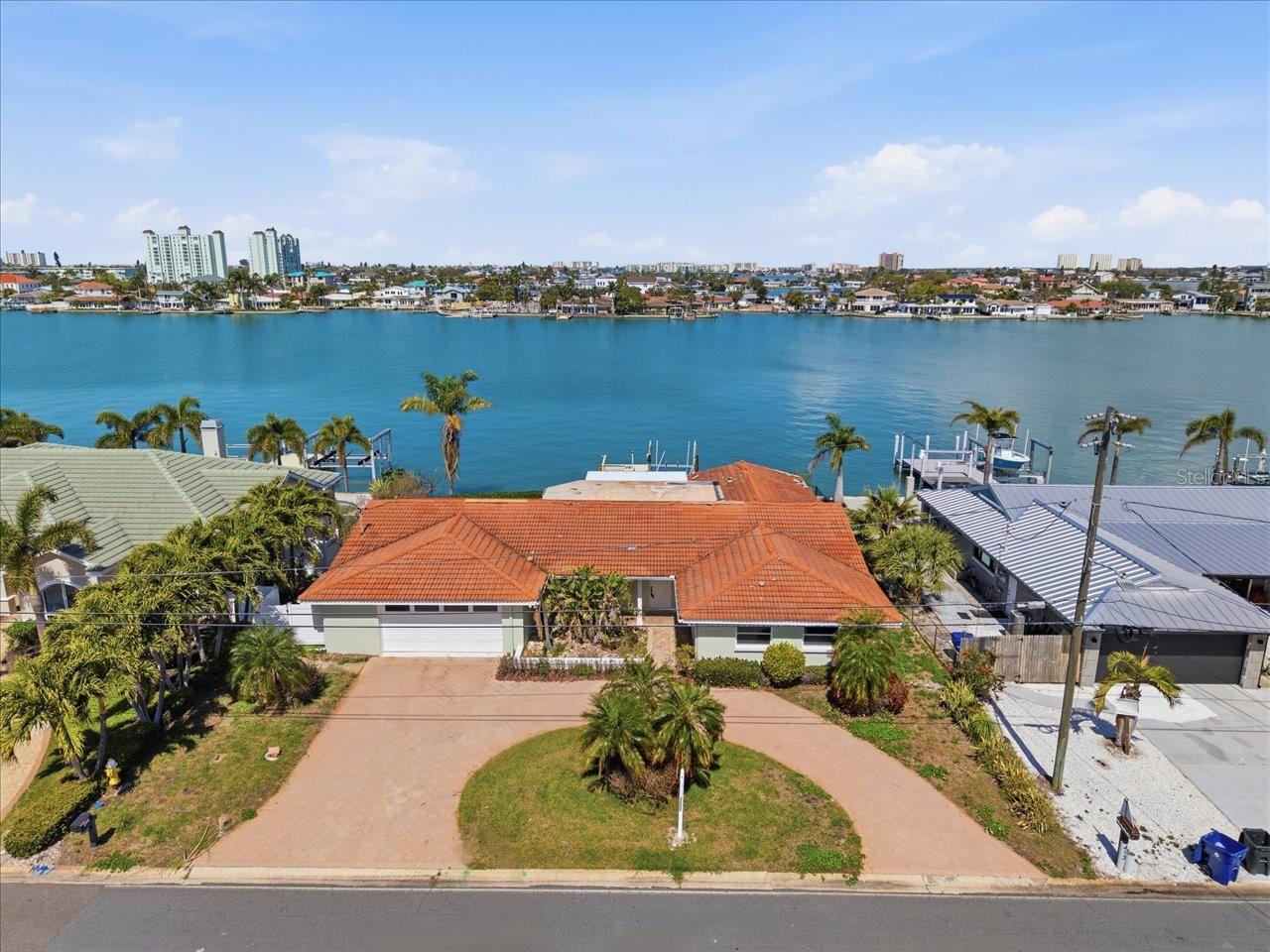 HOME HAS BEEN REMEDIATED BUT NOT RESTORED.  IT IS A BLANK CANVAS FOR YOU TO ENJOY.  YOU HAVE PLENTY OF MONEY ($300,000) BASED ON FEMA RULES TO UPDATE THE PROPERTY.  PROPERTY IS NOT SUBSTANTIALLY DAMAGED!  ST PETE BEACH IS THE BEST BEACH IN PINELLAS COUNTY.  30 BARS AND FINE DINING RESTAURANTS WITHIN WALKING DISTANCE.  ONLY A SHORT WALK TO DEEDED BEACH ACCESS. 55TH AVE IS THE MOST COVETED STREET IN ST PETE BEACH.  IT IS THE STREET EVERYBODY ASPIRES TO BE ON.  4 BEDROOMS & 3.5 BATHS.  SWIMMING POOL NEEDS TO BE RESTORED AS DOES THE DOCK & BOAT LIFT.  THIS HOME WAS FULLY RESTORED PRIOR TO THE HURRICANES.  FLOOR PLAN CONCEPT IS ALREADY UPDATED.  LET'S SCHEDULE AN APPOINTMENT FOR YOU TO SEE IT.